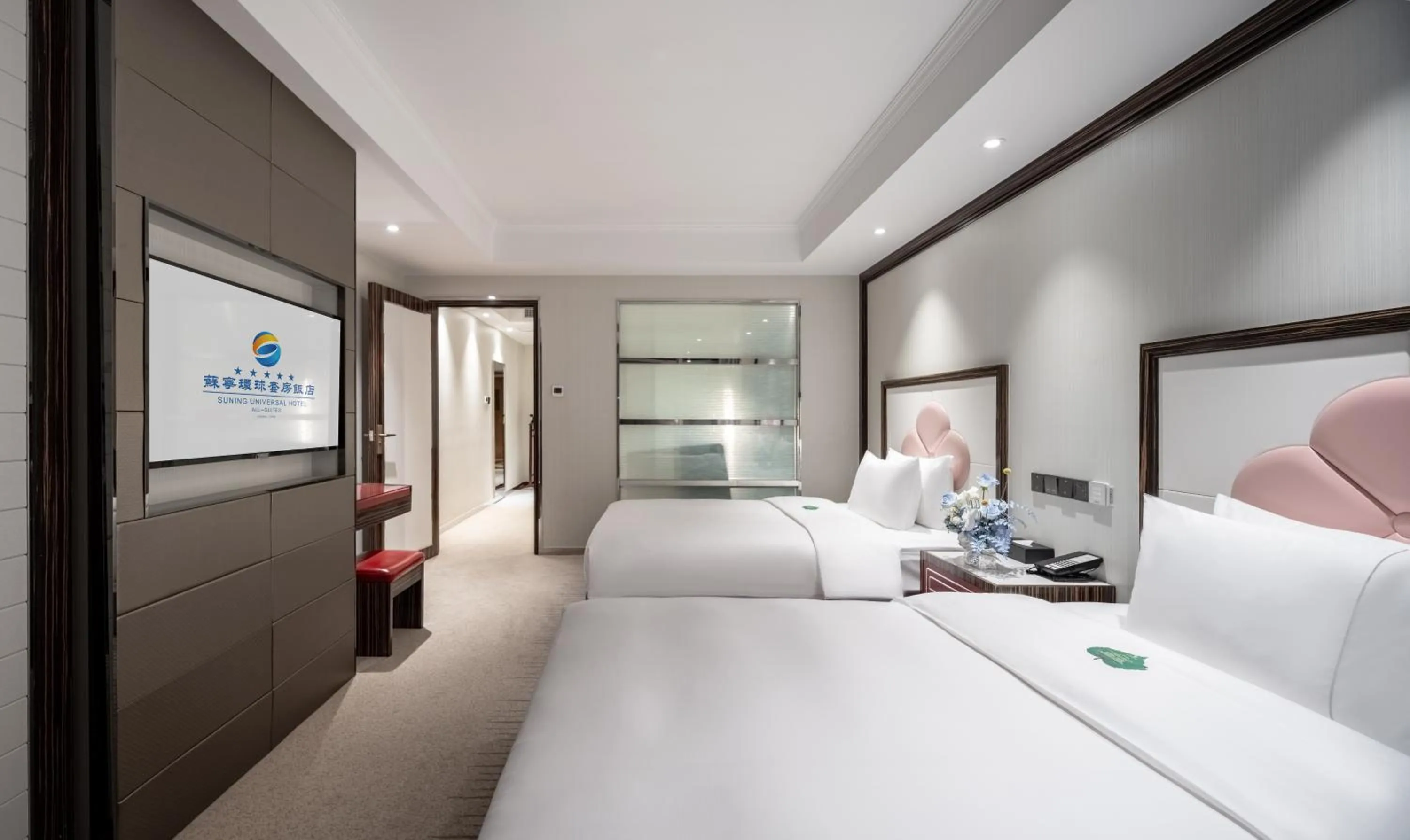 Bed in Suning Universal Hotel ALL-SUITES