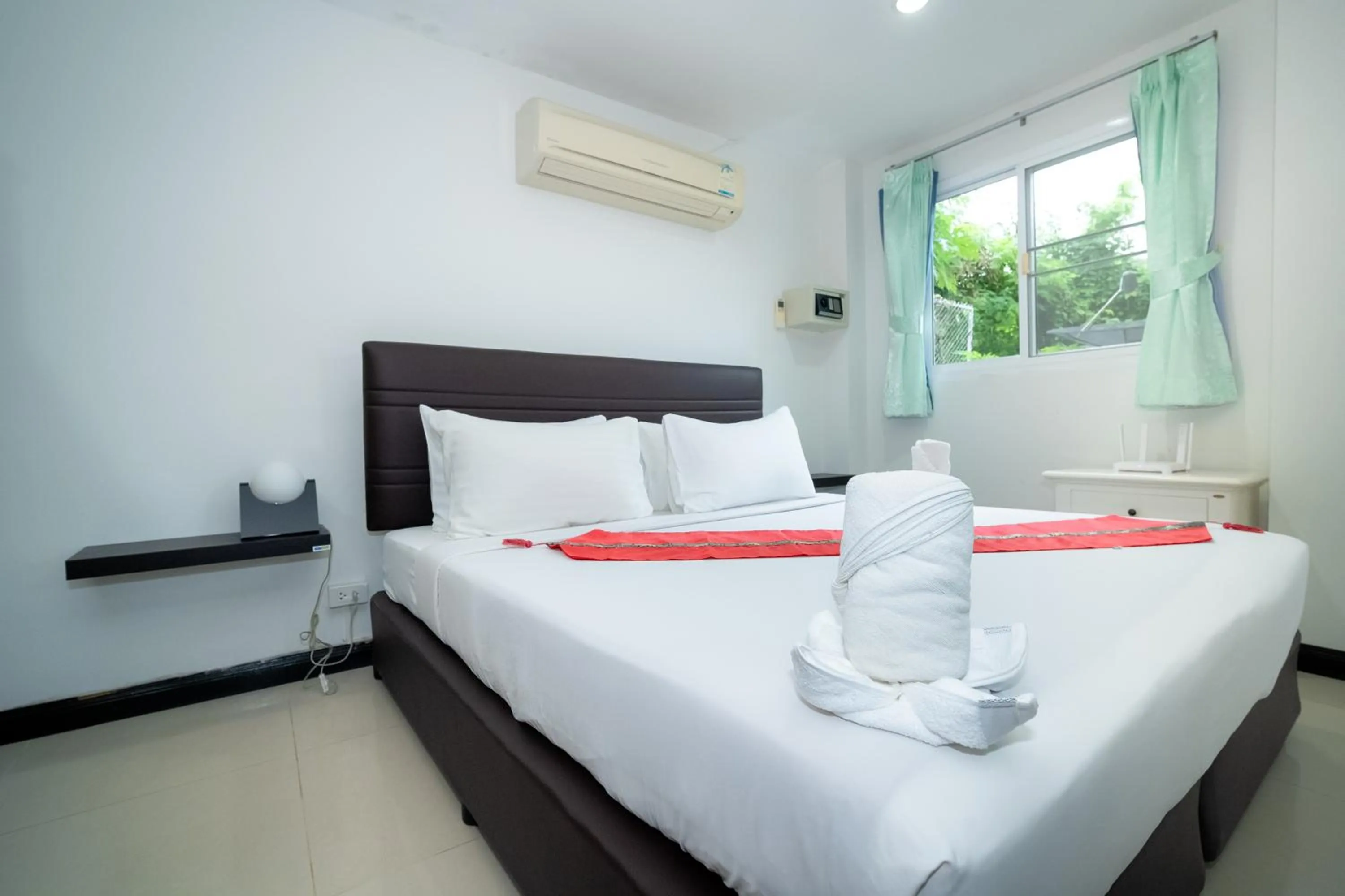 Bed in ฺBaan Waru seaview villa