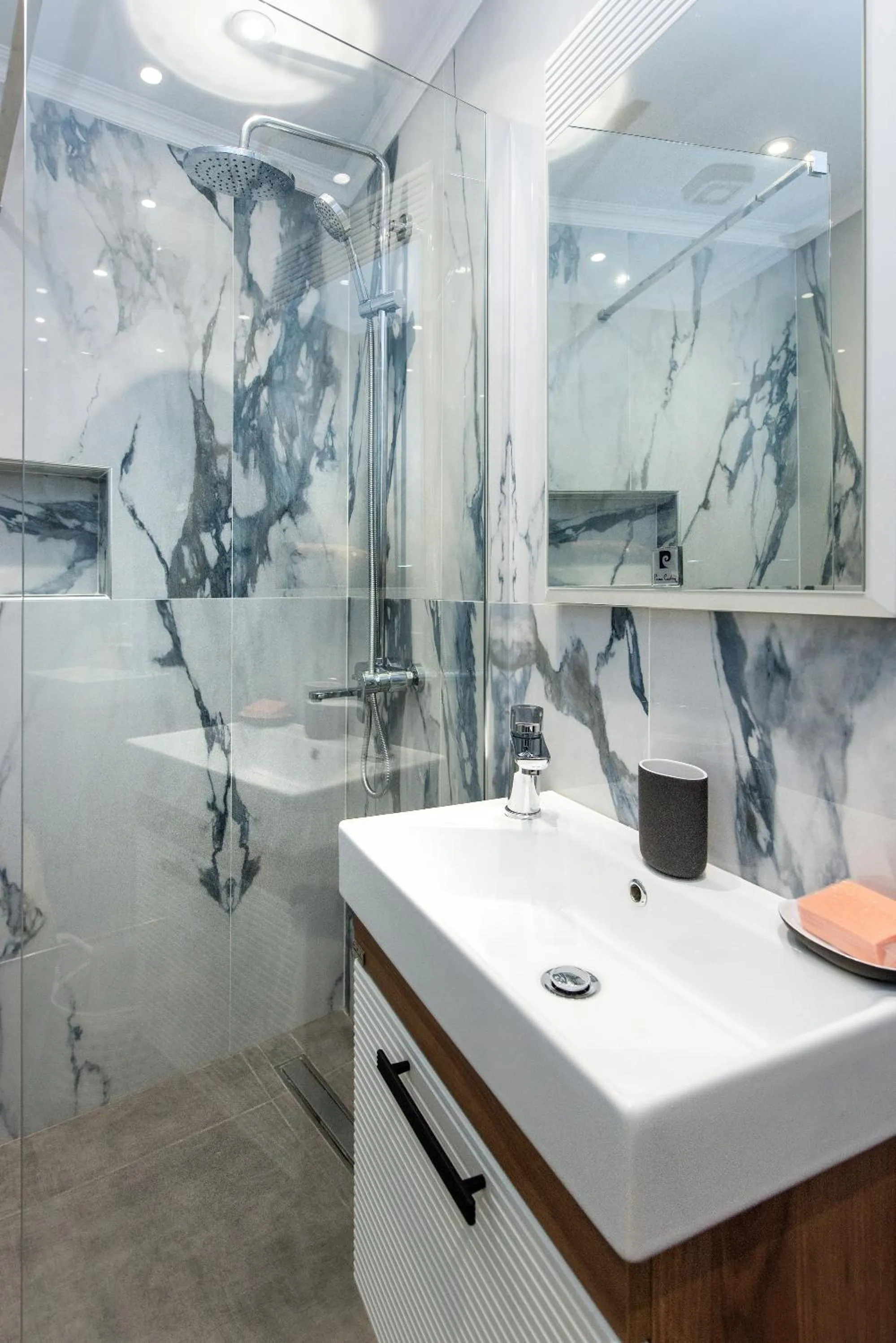 Bathroom in Pelagia Apartment by Kormaris