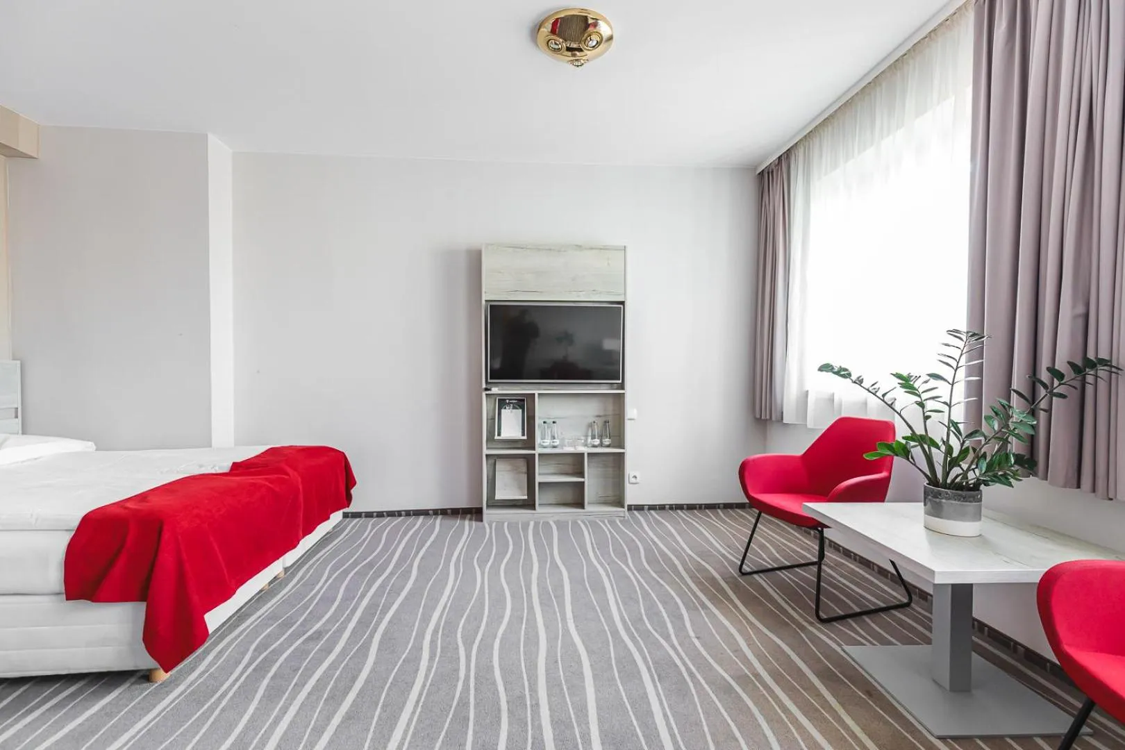 Communal lounge/ TV room, Bed in Hotel Akwawit