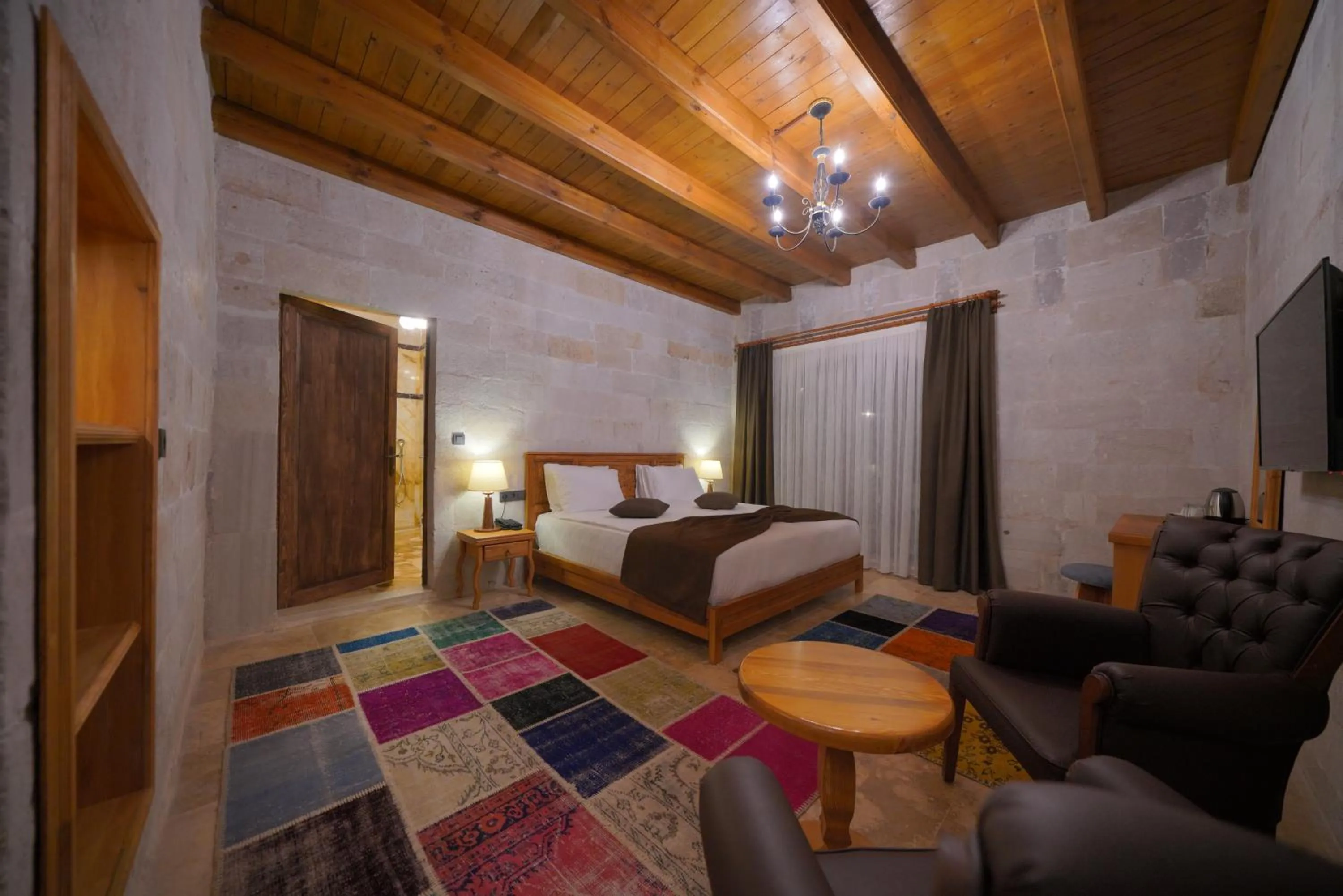 Communal lounge/ TV room, Bed in Cappadocia Secret Hill Cave Suites