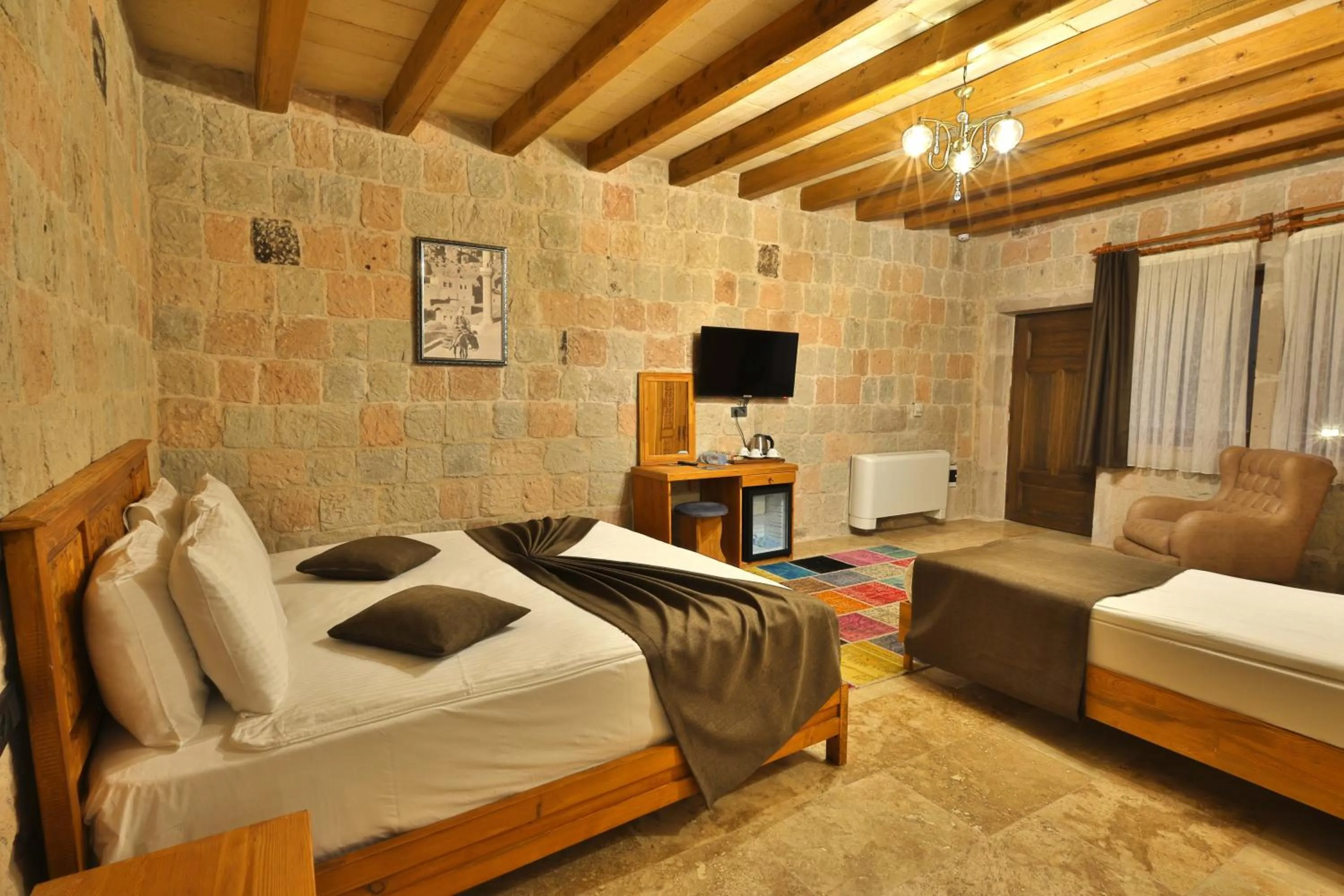 Communal lounge/ TV room, Bed in Cappadocia Secret Hill Cave Suites