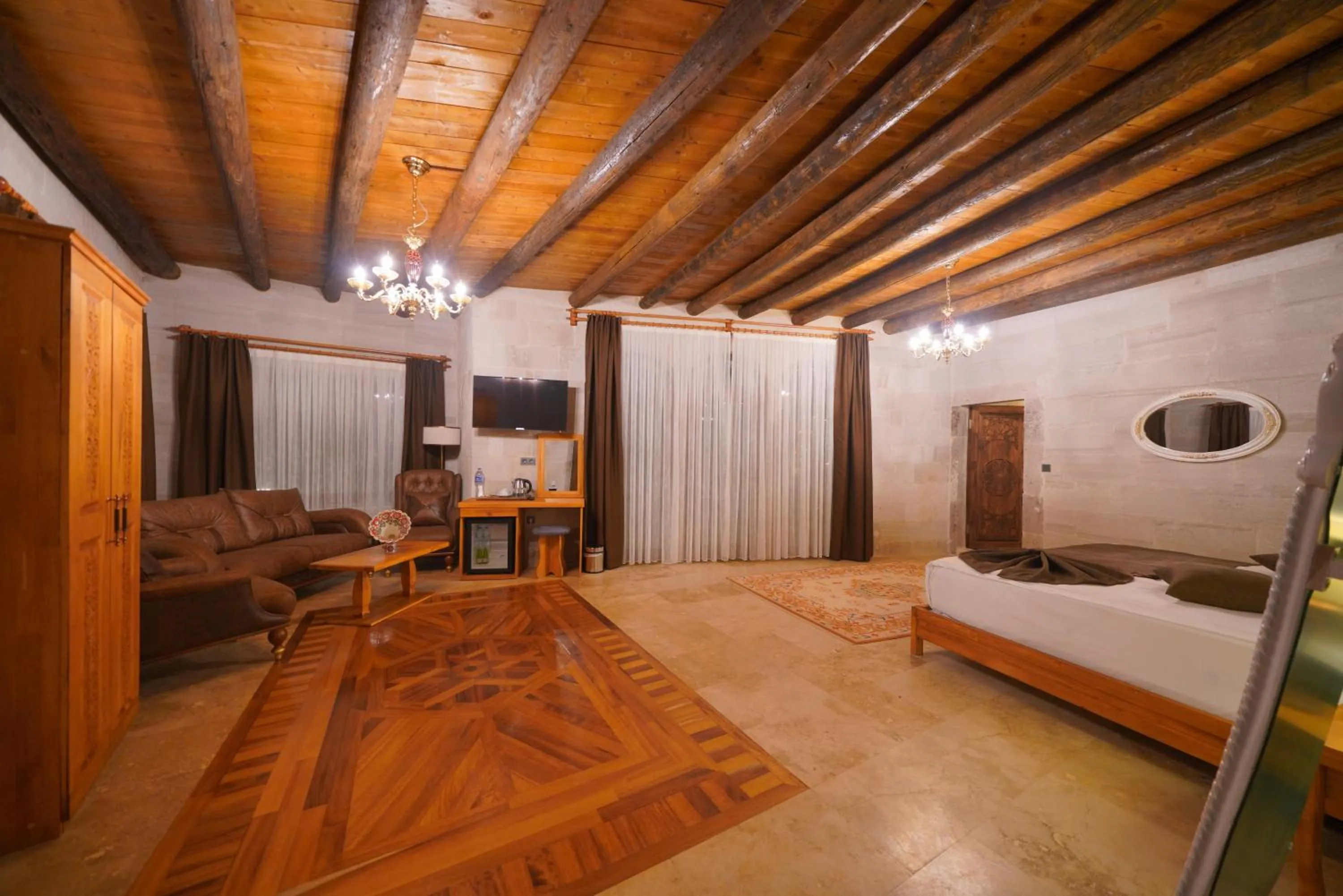 Communal lounge/ TV room, Bed in Cappadocia Secret Hill Cave Suites