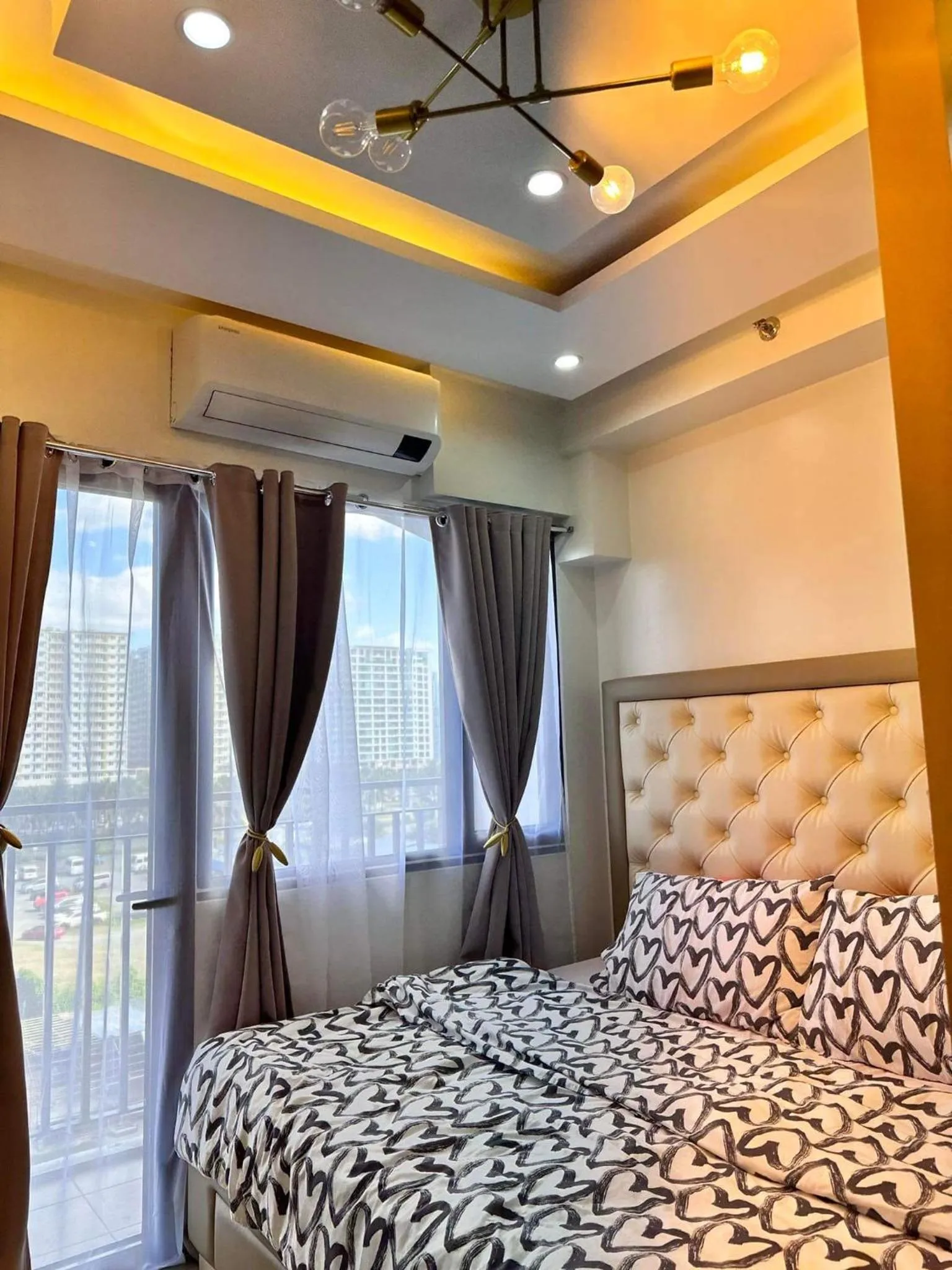 Bed in Deluxe Suites Razelles 2 at Shore 2 Residences Tower 1