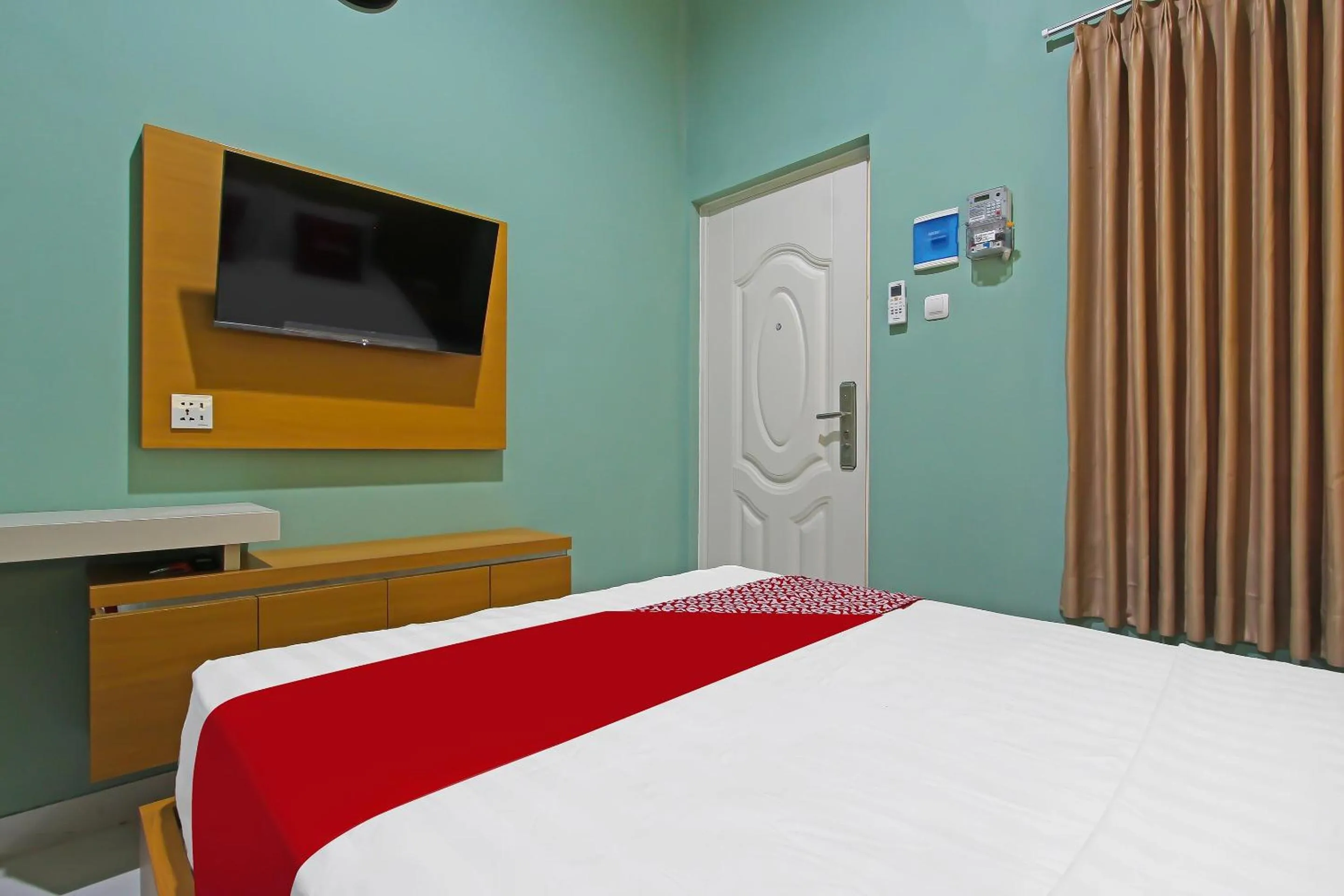 Bedroom in Capital O 92105 A'shanti Inn