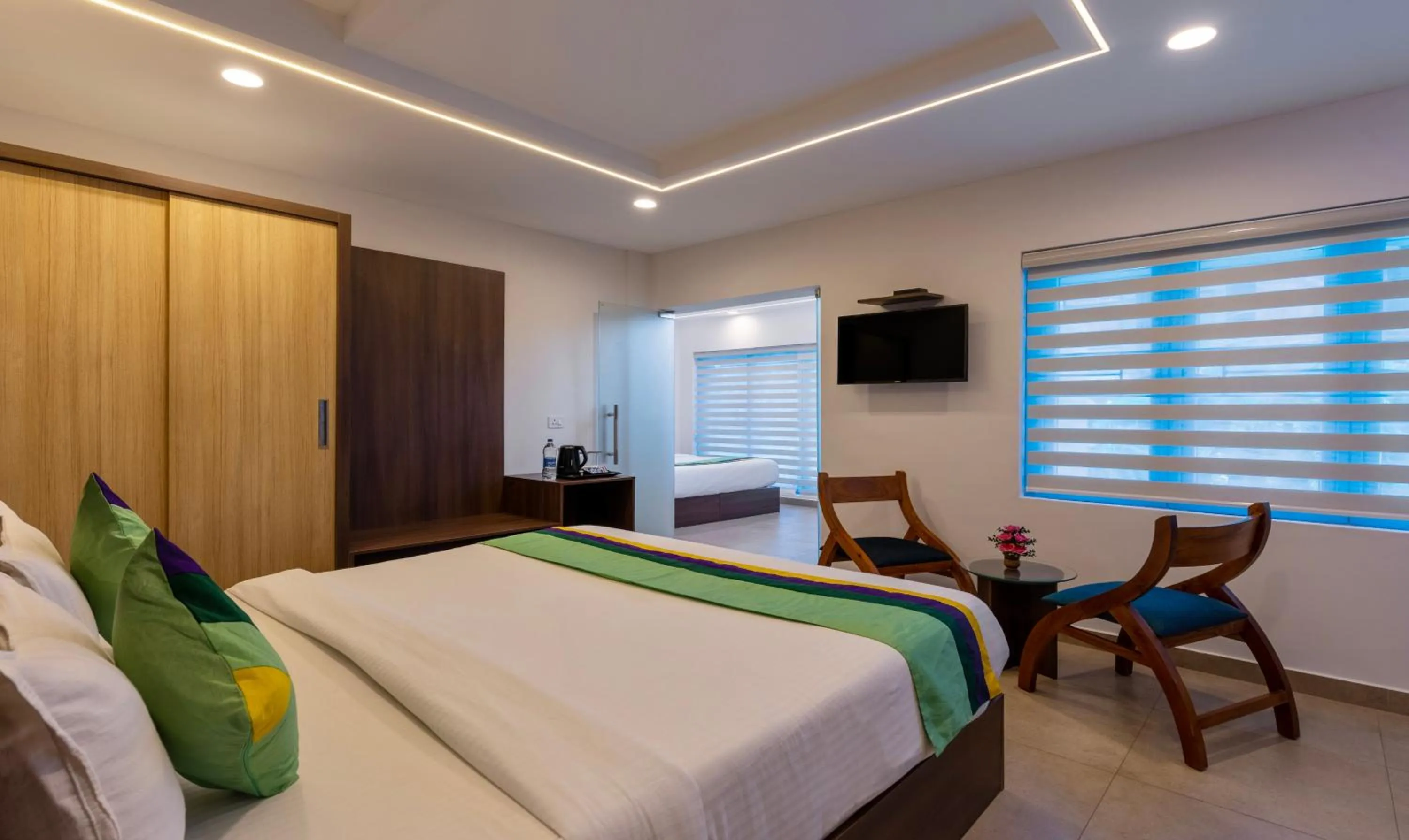 Bed in Treebo vSaffron Regency, Punnamada Lake