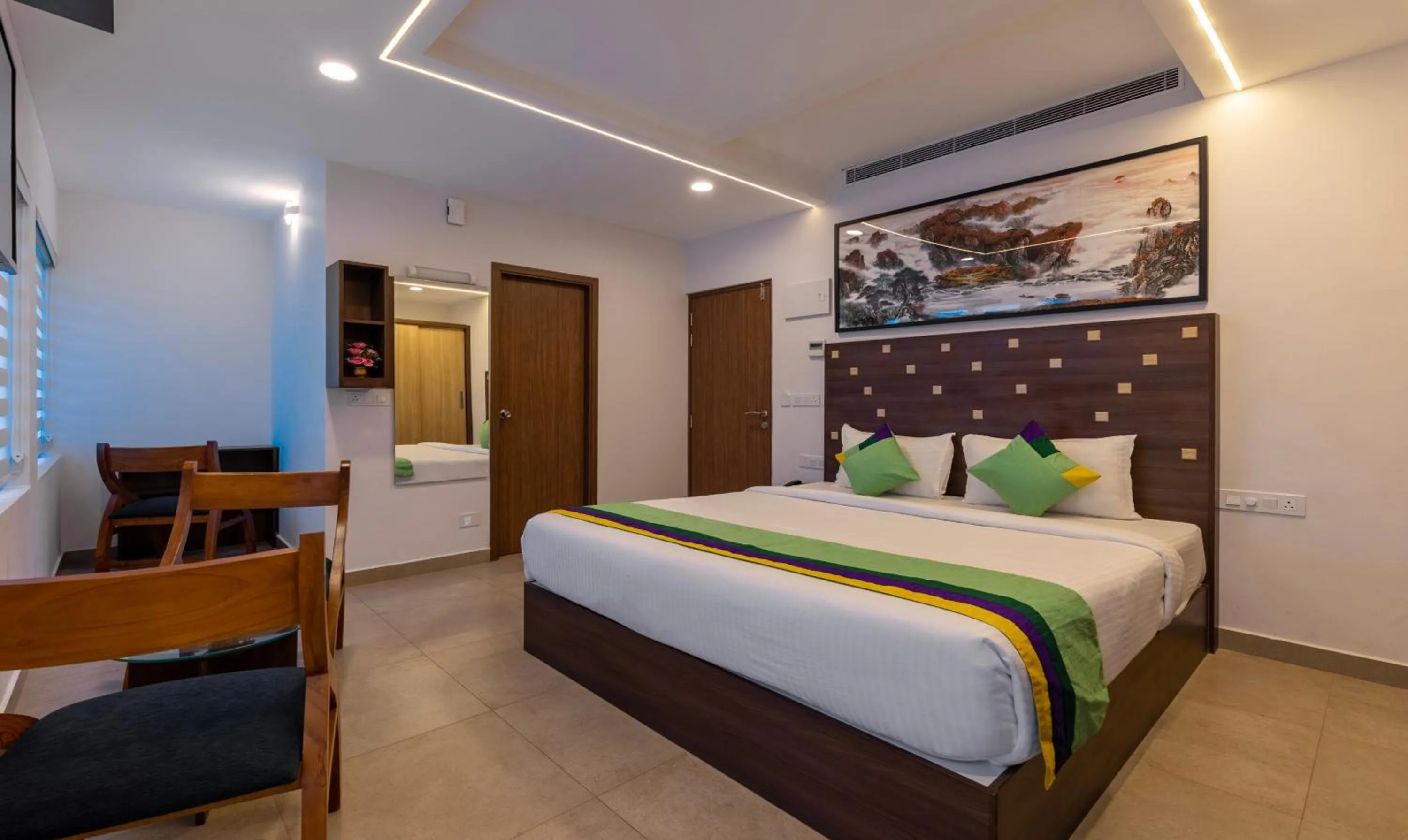 Bed in Treebo vSaffron Regency, Punnamada Lake