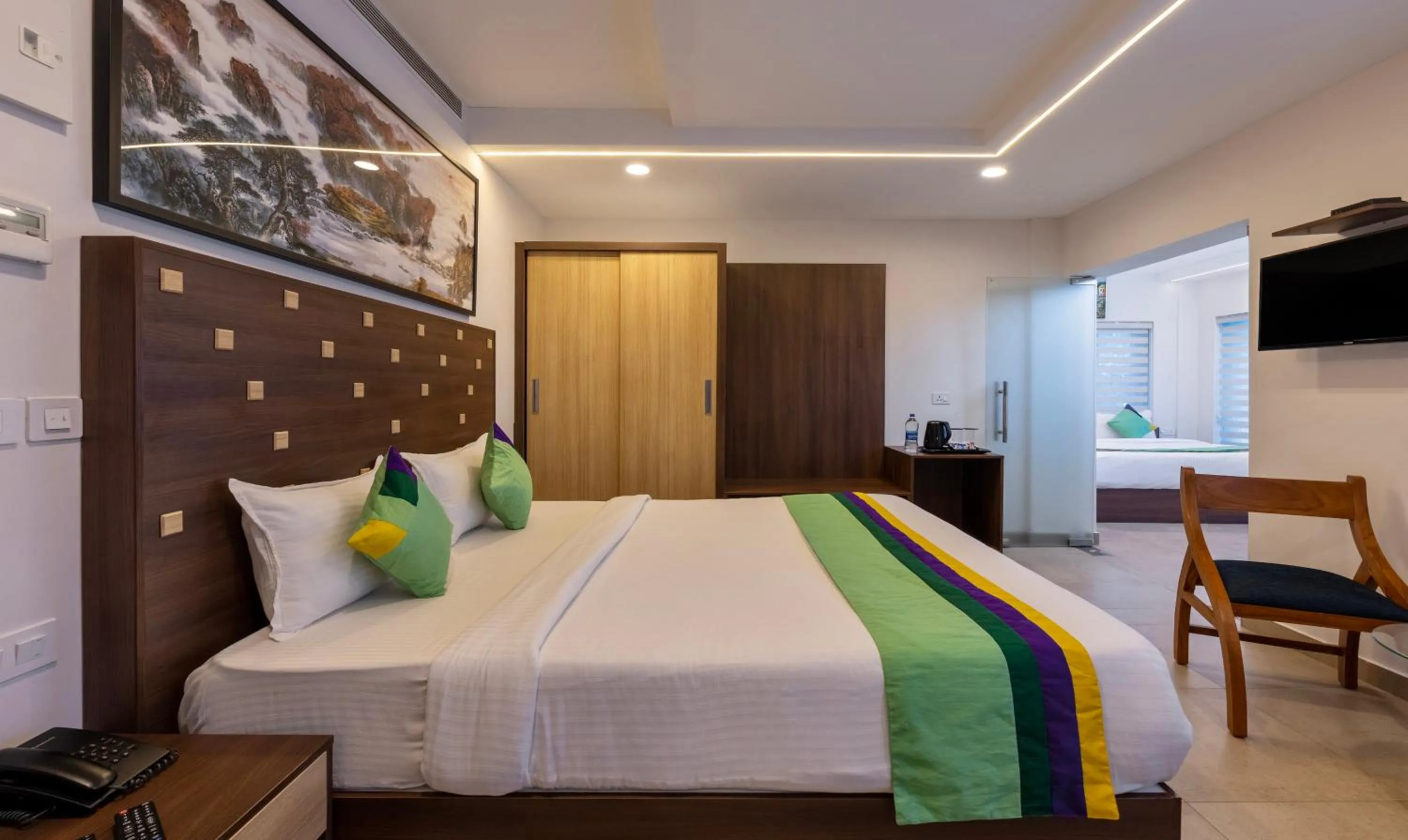 Bed in Treebo vSaffron Regency, Punnamada Lake