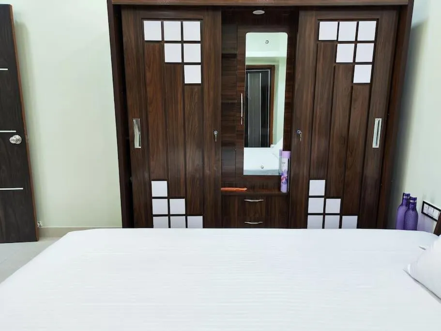 Bed in 1BHK AC Service Apartment 202