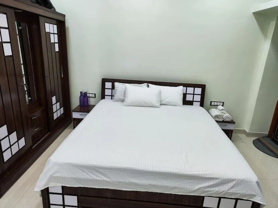 Bed in 1BHK AC Service Apartment 202