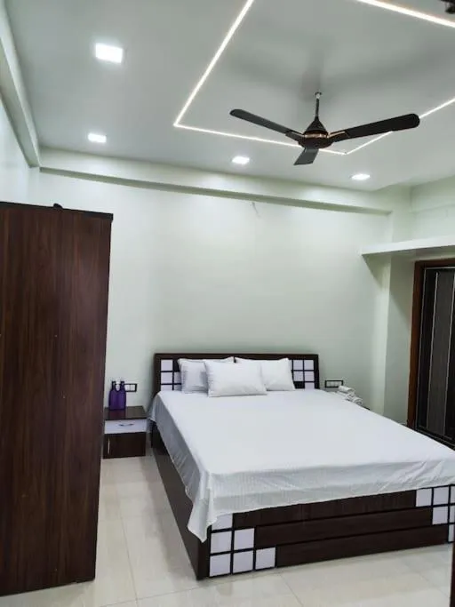 Bed in 1BHK AC Service Apartment 202