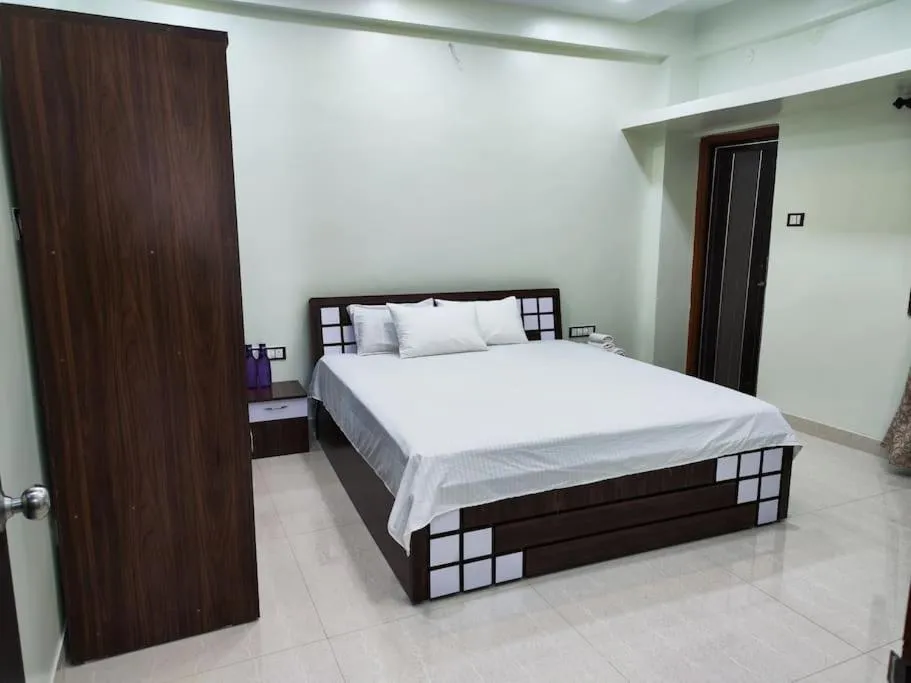 Bed in 1BHK AC Service Apartment 202