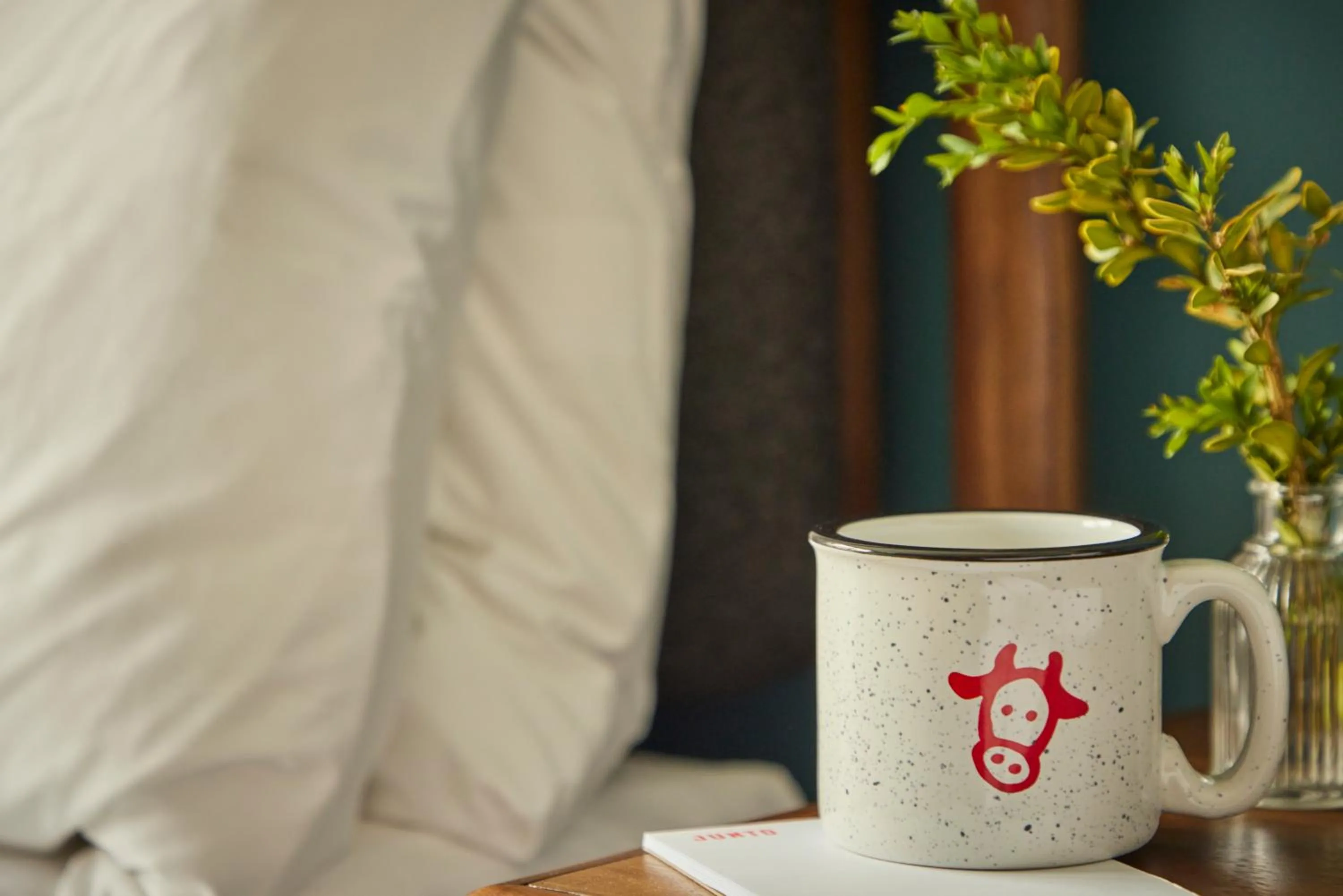 Bed in The Junto Hotel