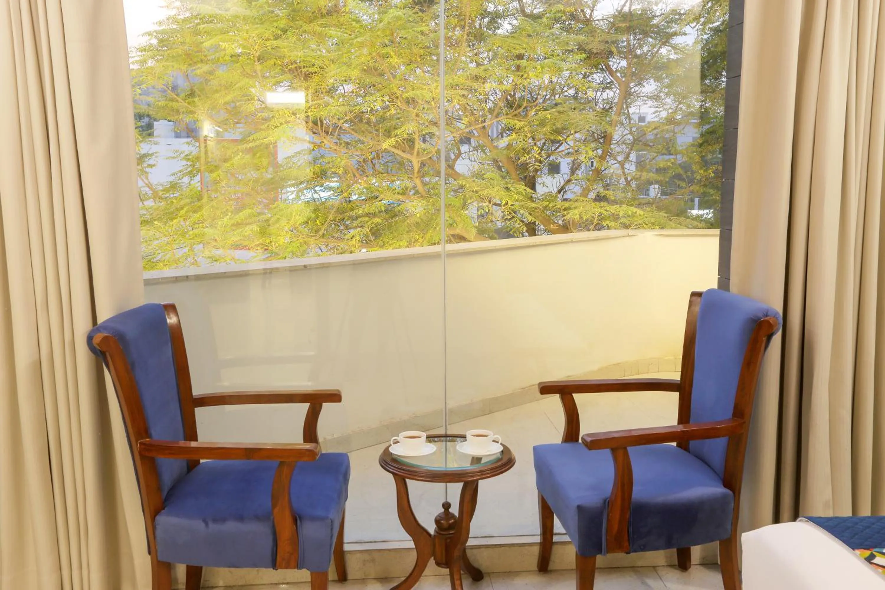 Seating area in Hotel Cardinal Oxmo Delhi Airport