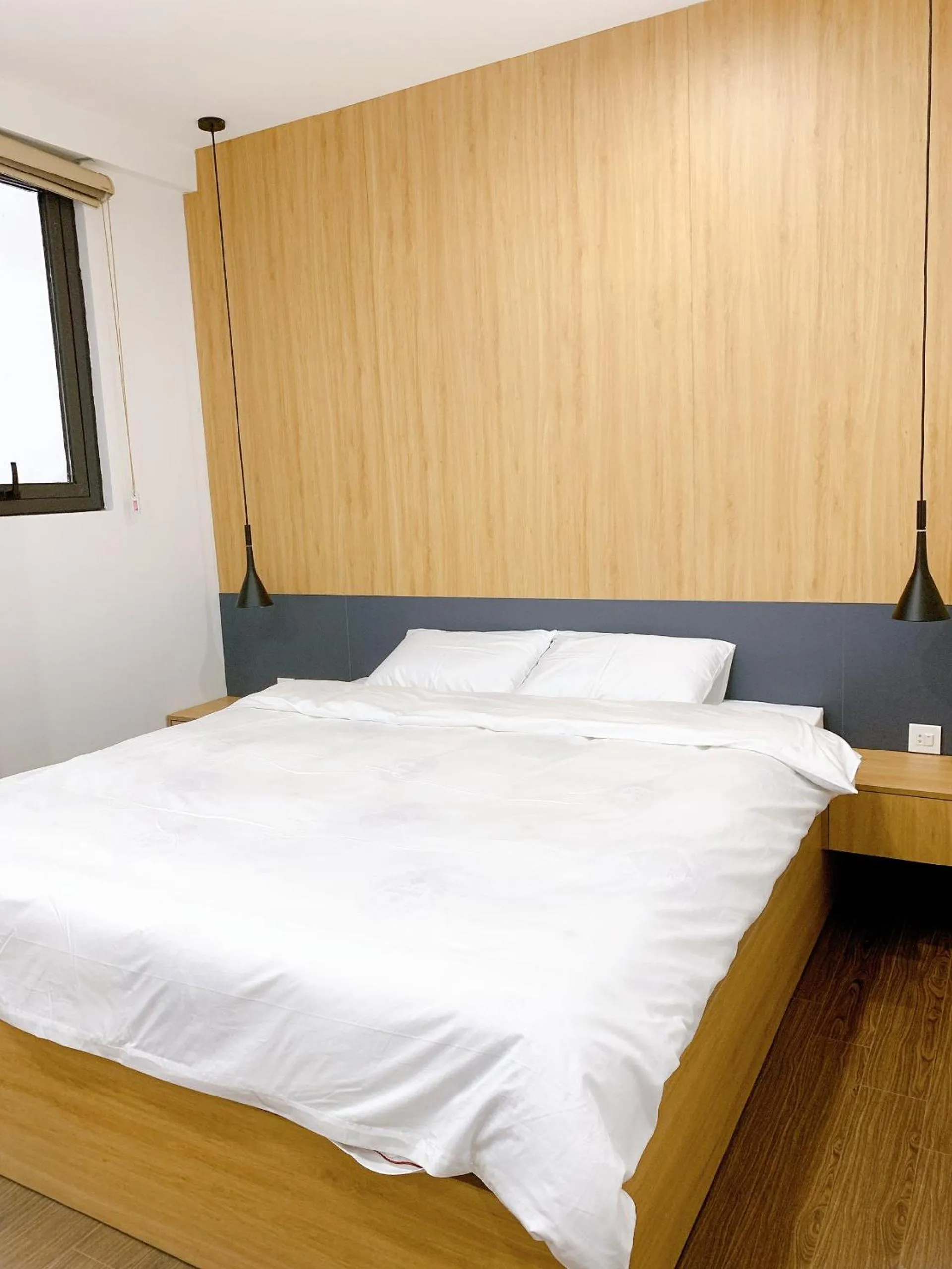 Bed in TSQ STAY Hotel Apartment
