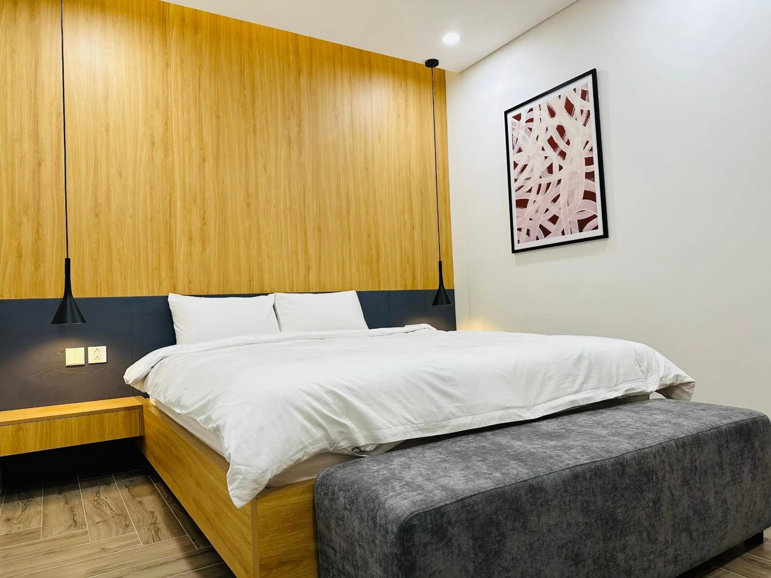 Bed in TSQ STAY Hotel Apartment