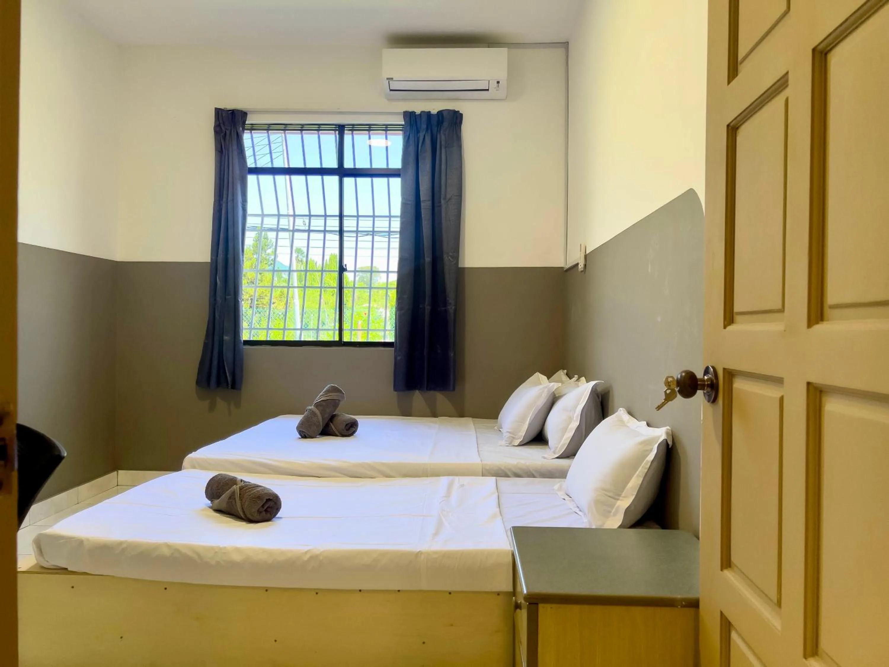 Bed in Hush Inn at Taman Penampang