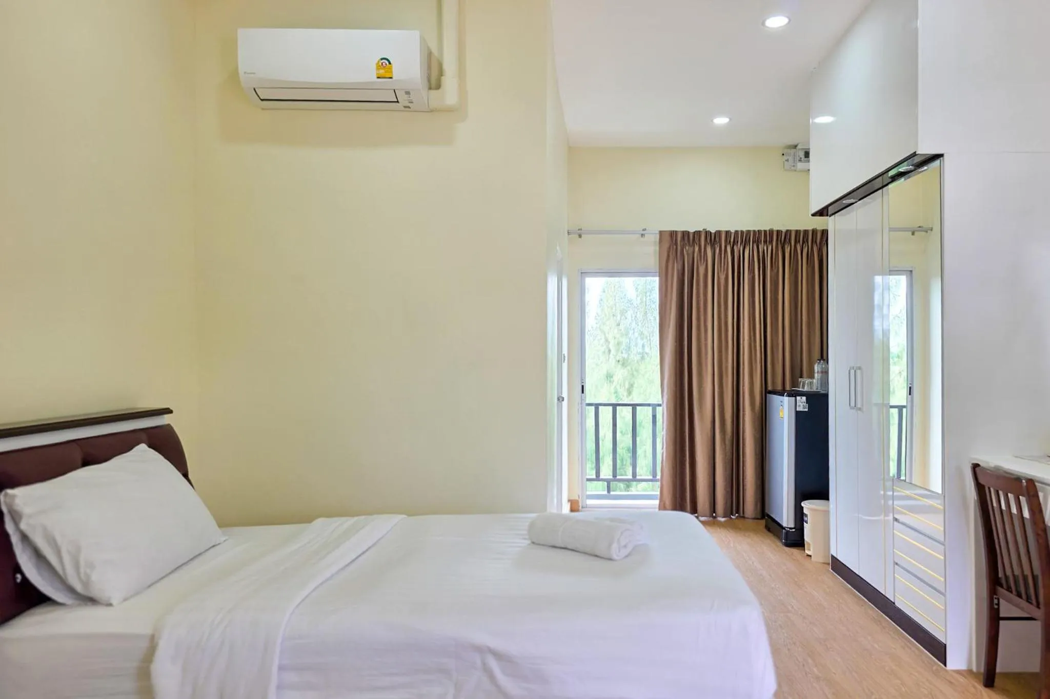 Bed in PT Grand Hotel