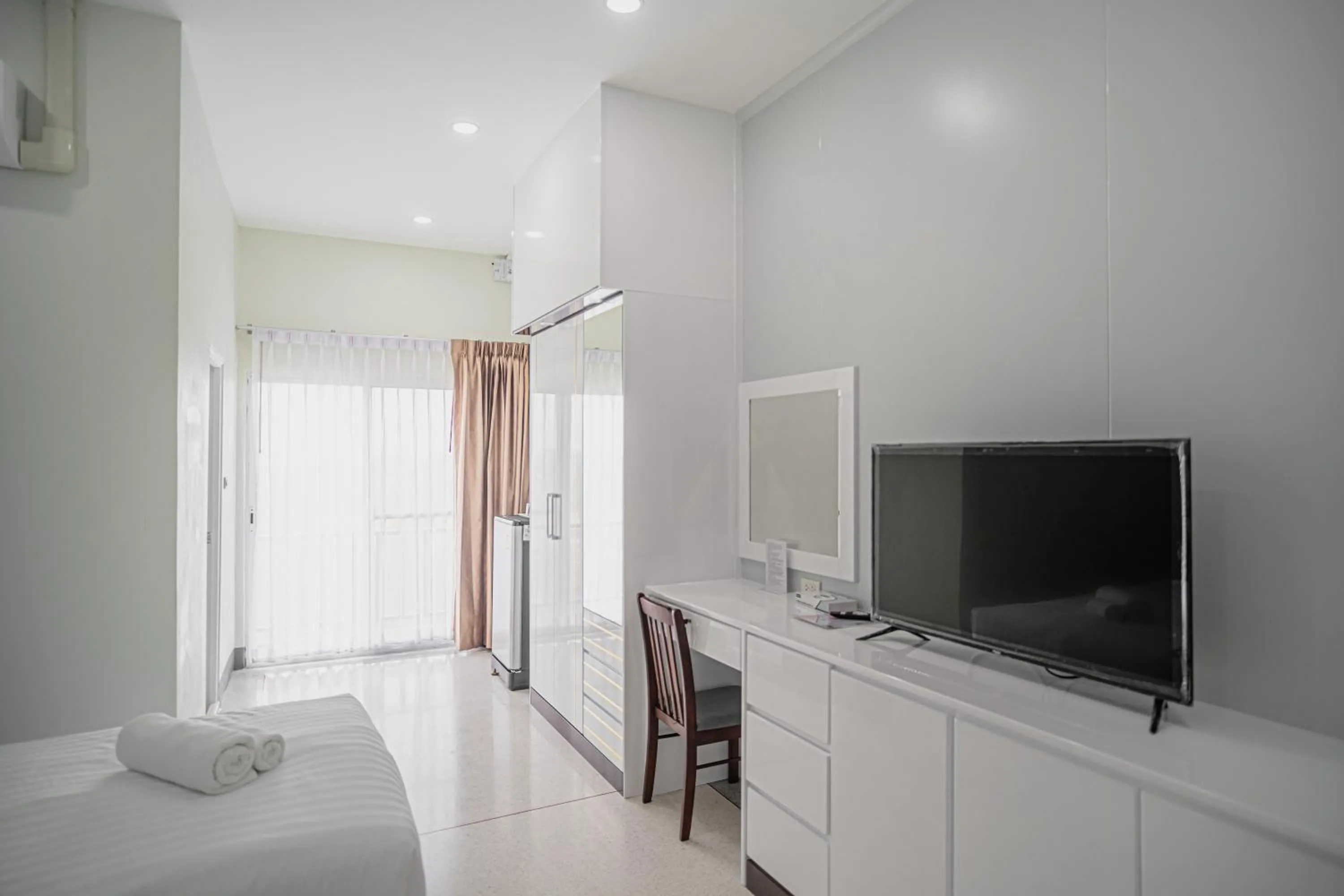 Bed in PT Grand Hotel