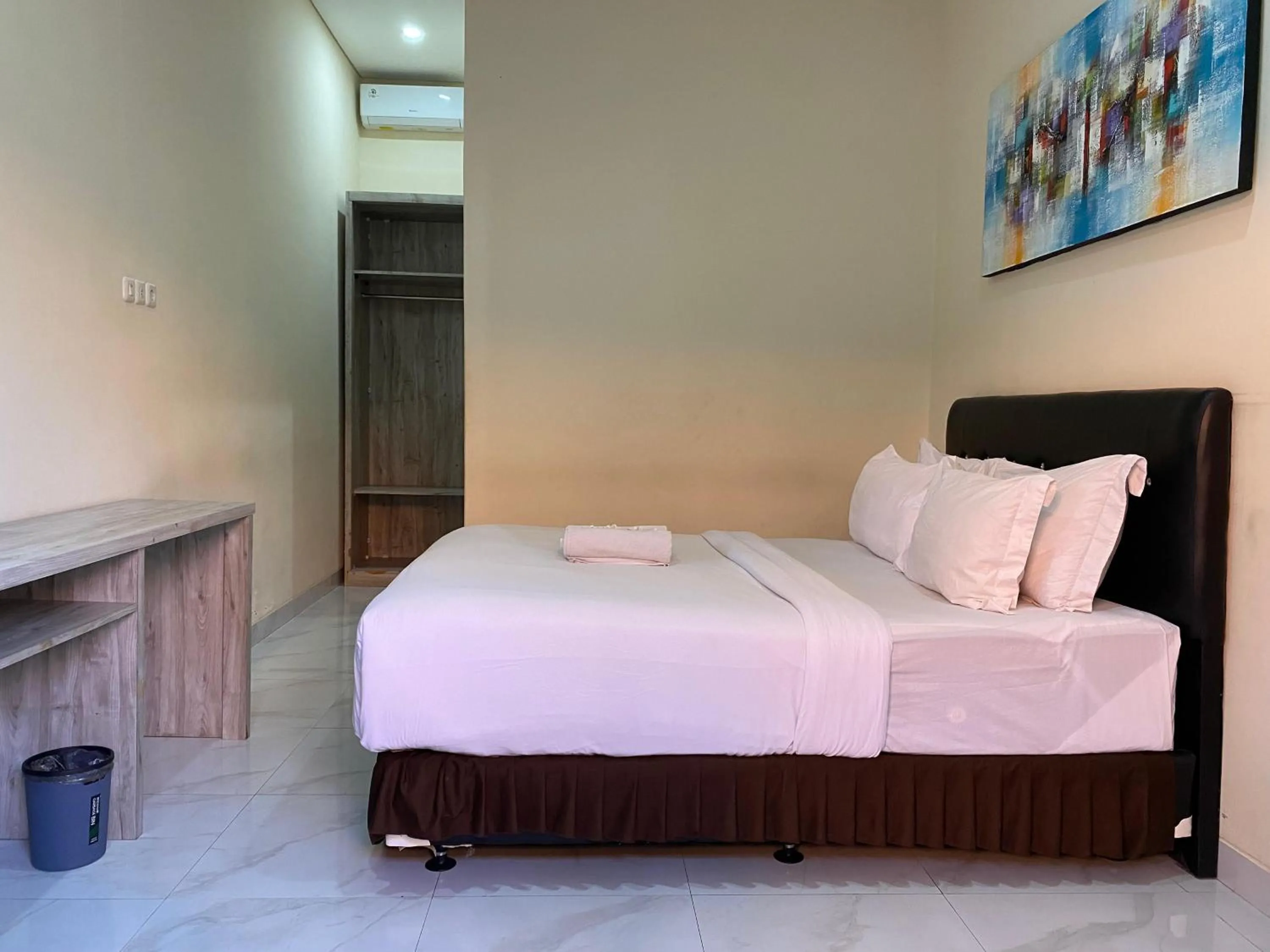 Bed in THE LAVIANA HOTEL