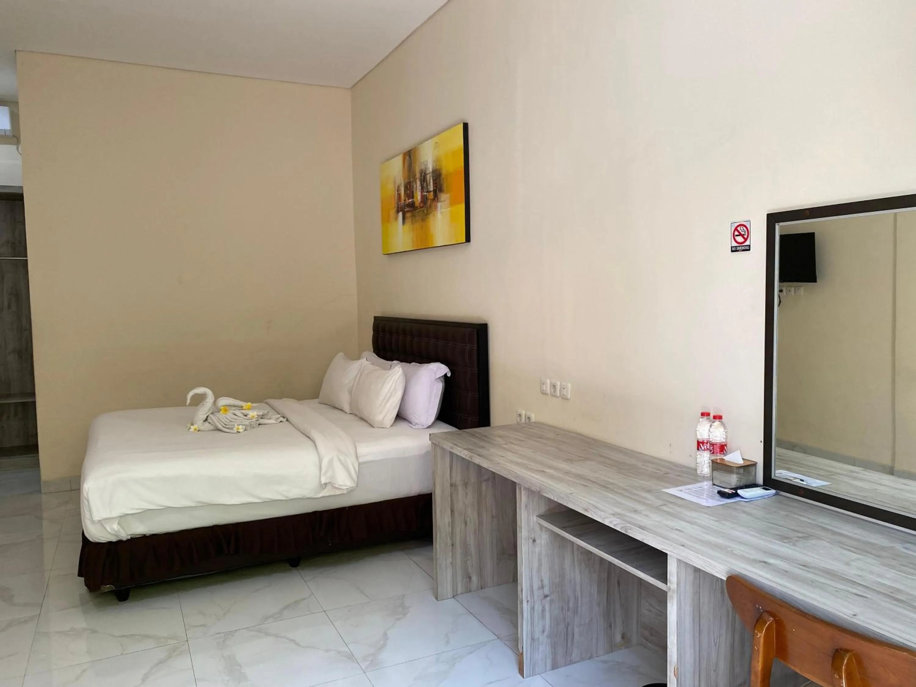 Bed in THE LAVIANA HOTEL