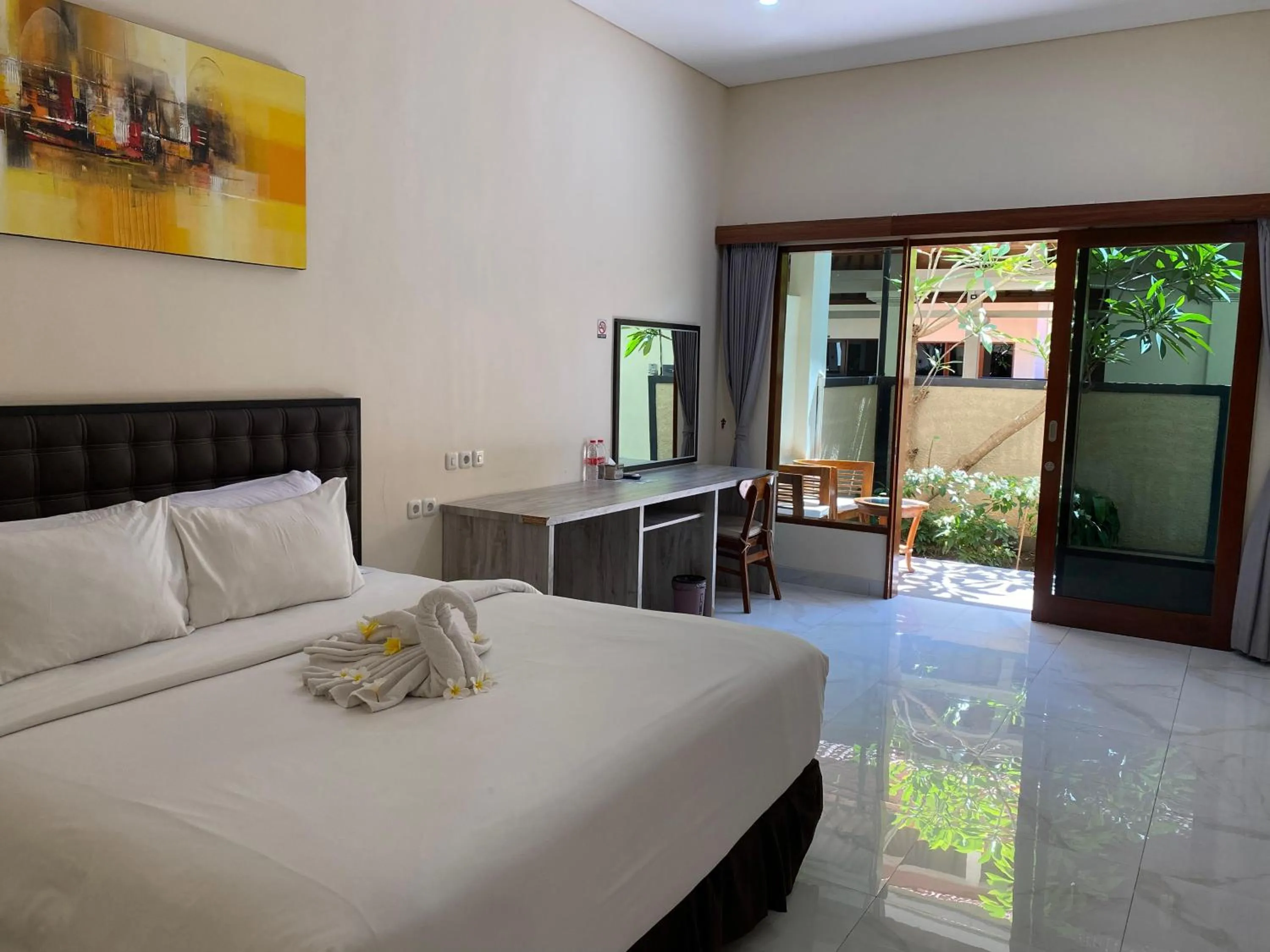 Bed in THE LAVIANA HOTEL