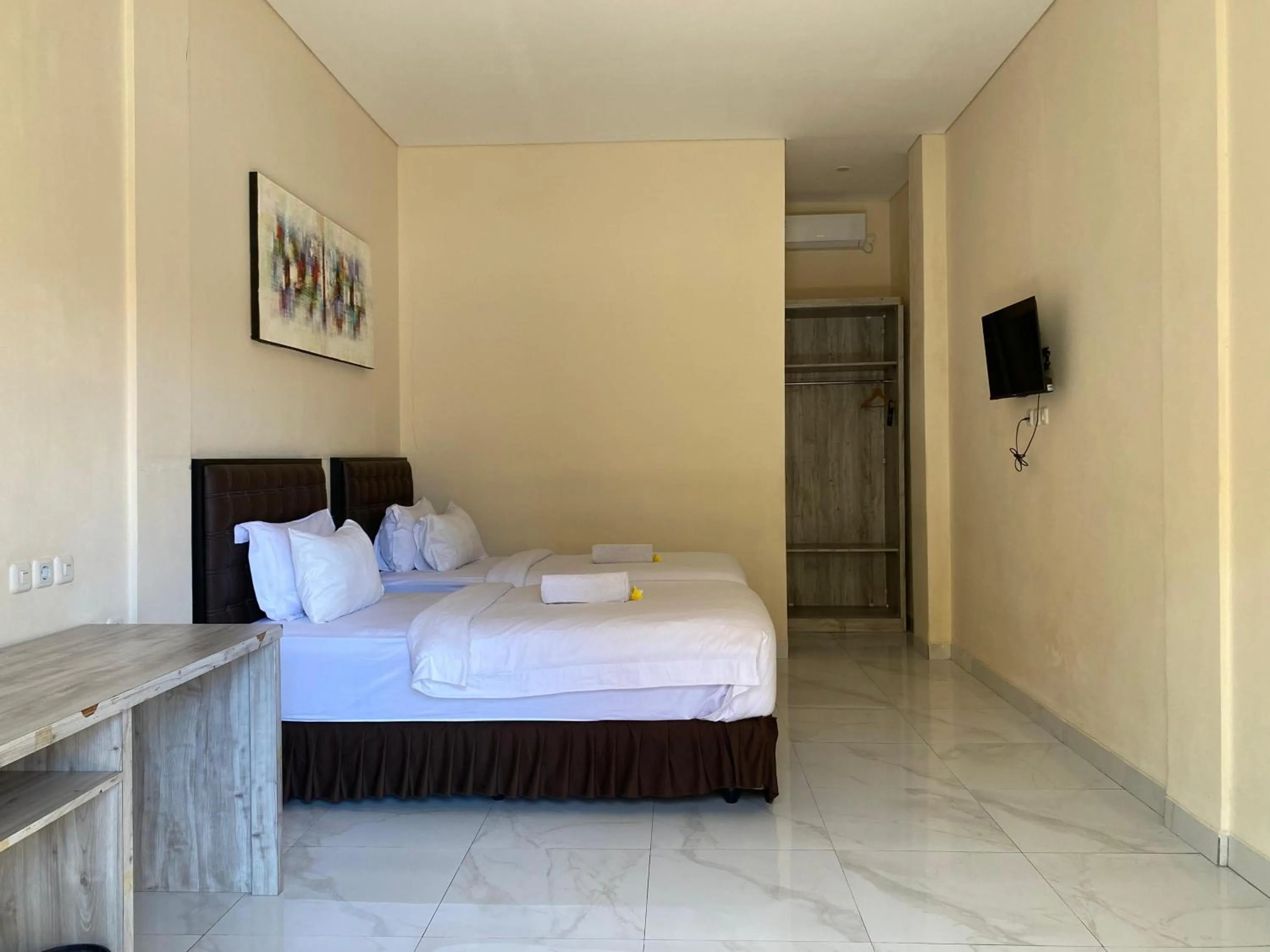 Bed in THE LAVIANA HOTEL