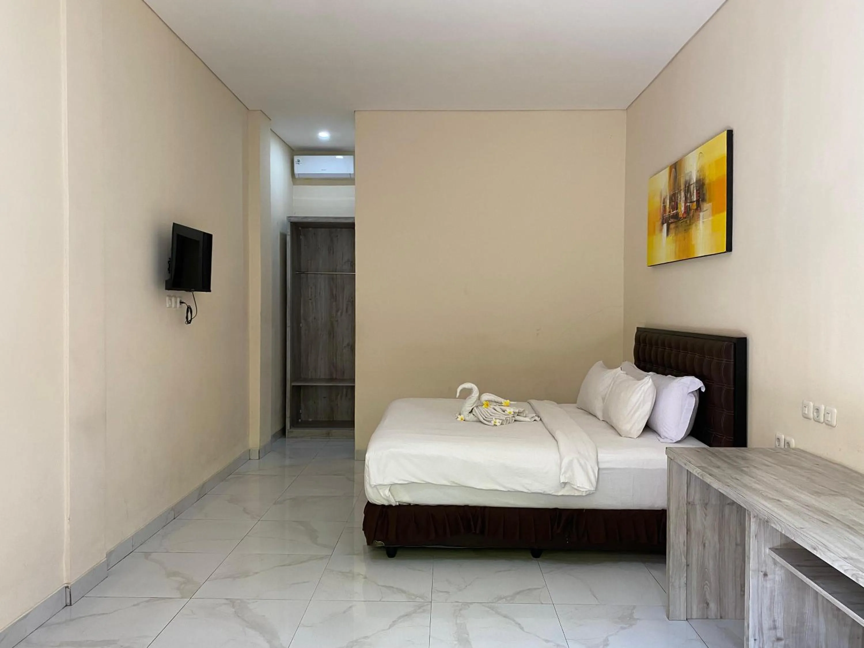 Bed in THE LAVIANA HOTEL