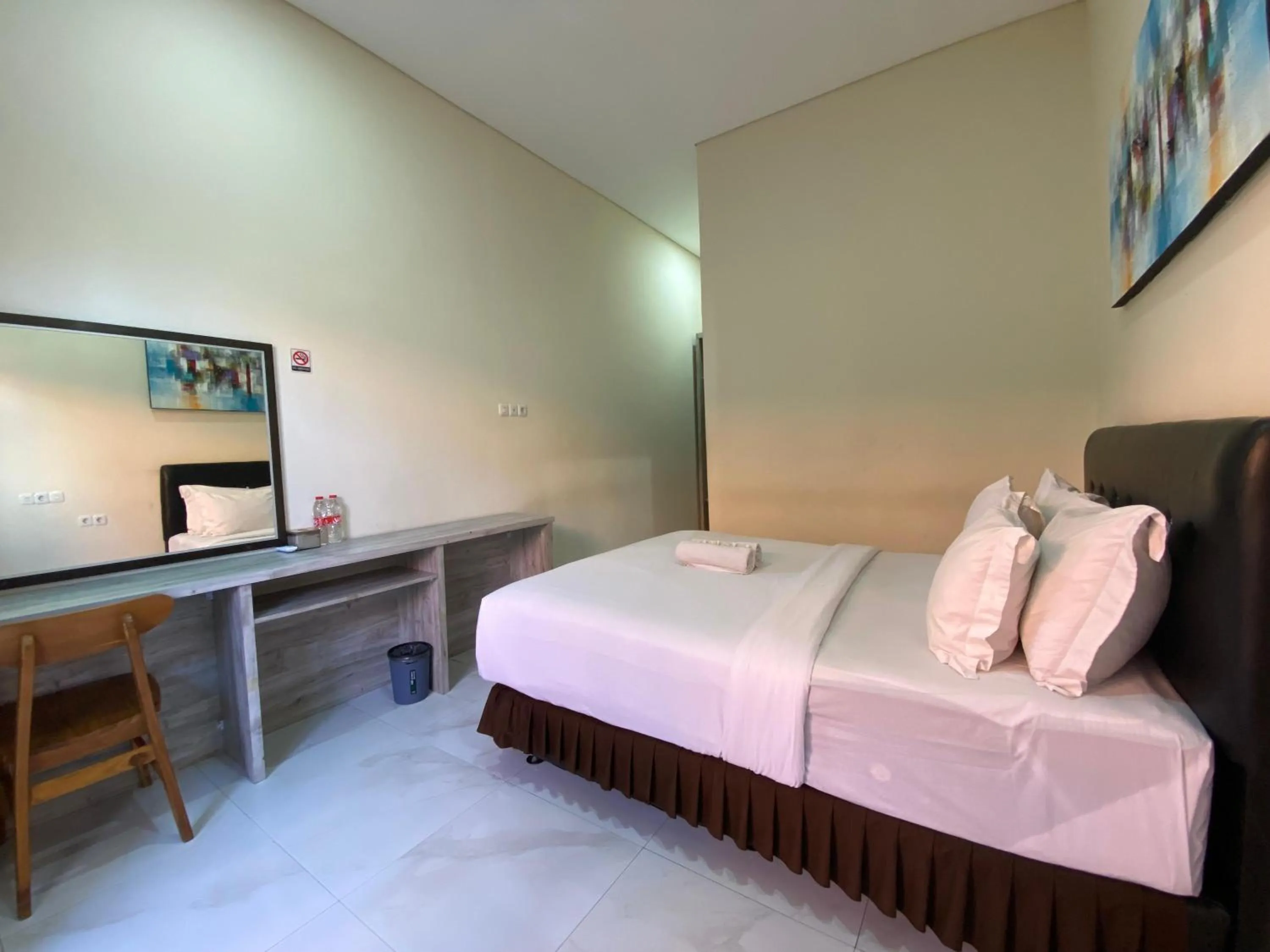 Bed in THE LAVIANA HOTEL