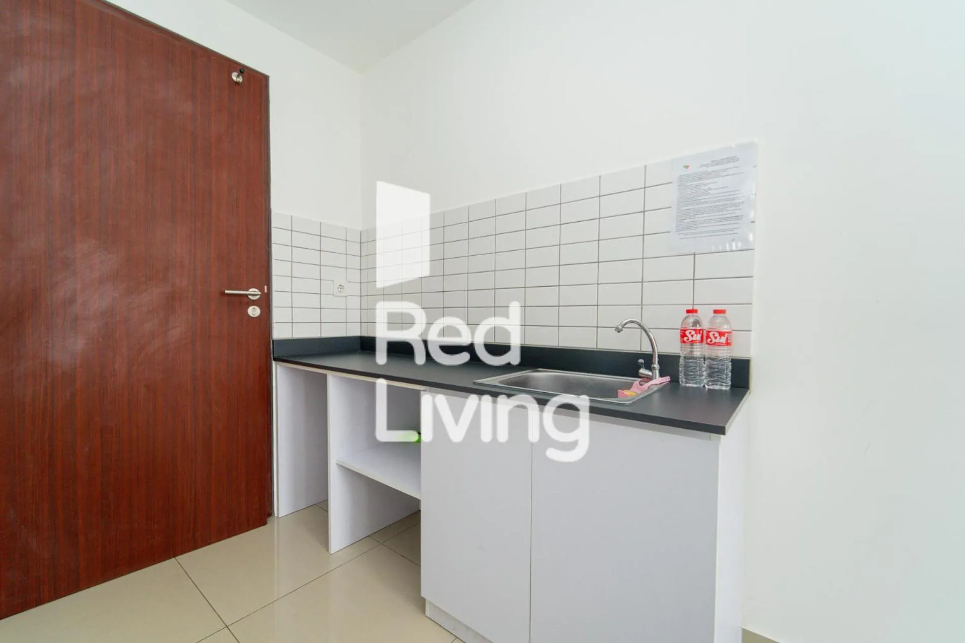 Kitchen or kitchenette in RedLiving Apartemen Sayana - Sentra Jaya