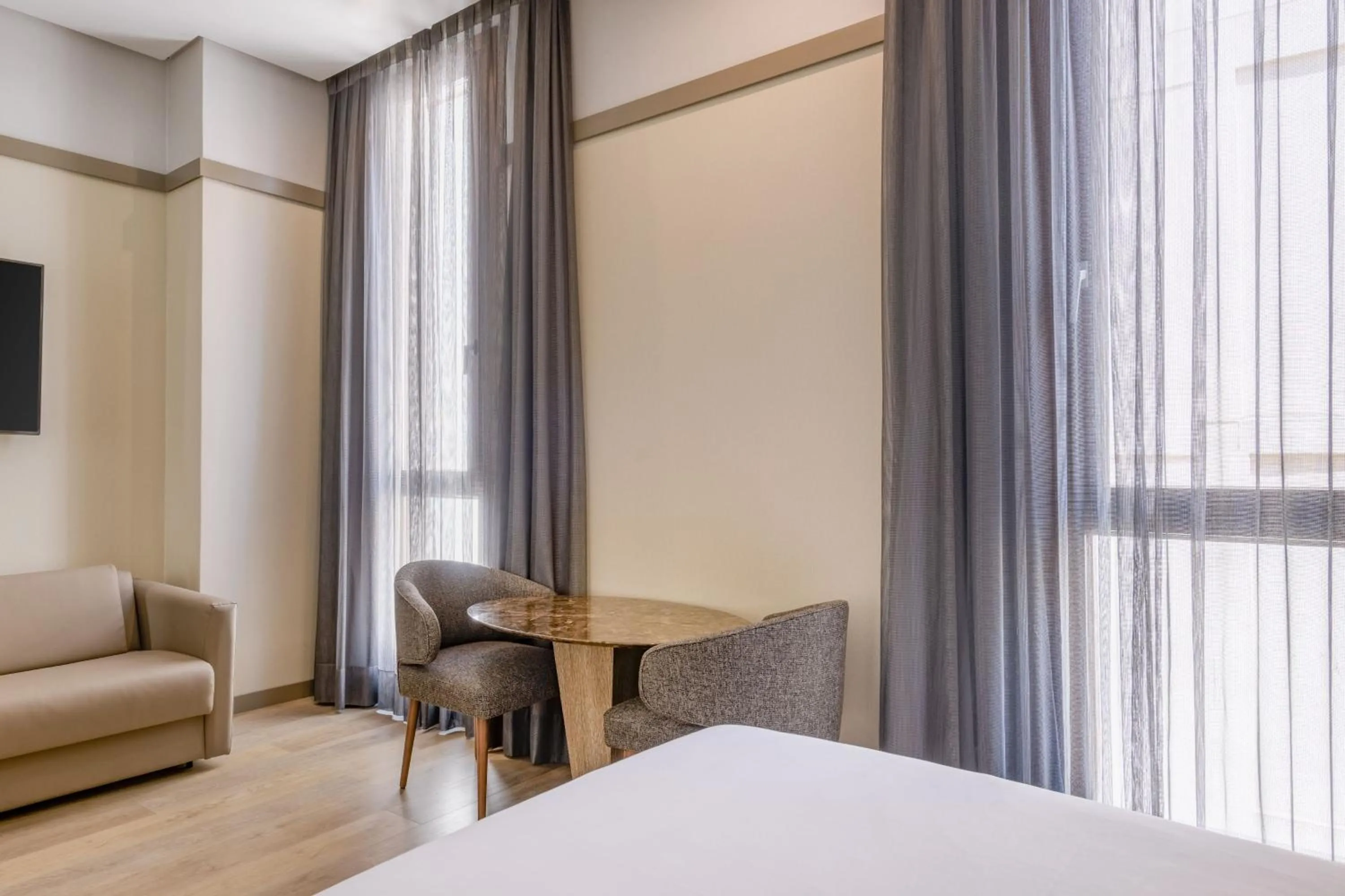 Photo of the whole room, Bed in AC Hotel Recoletos by Marriott