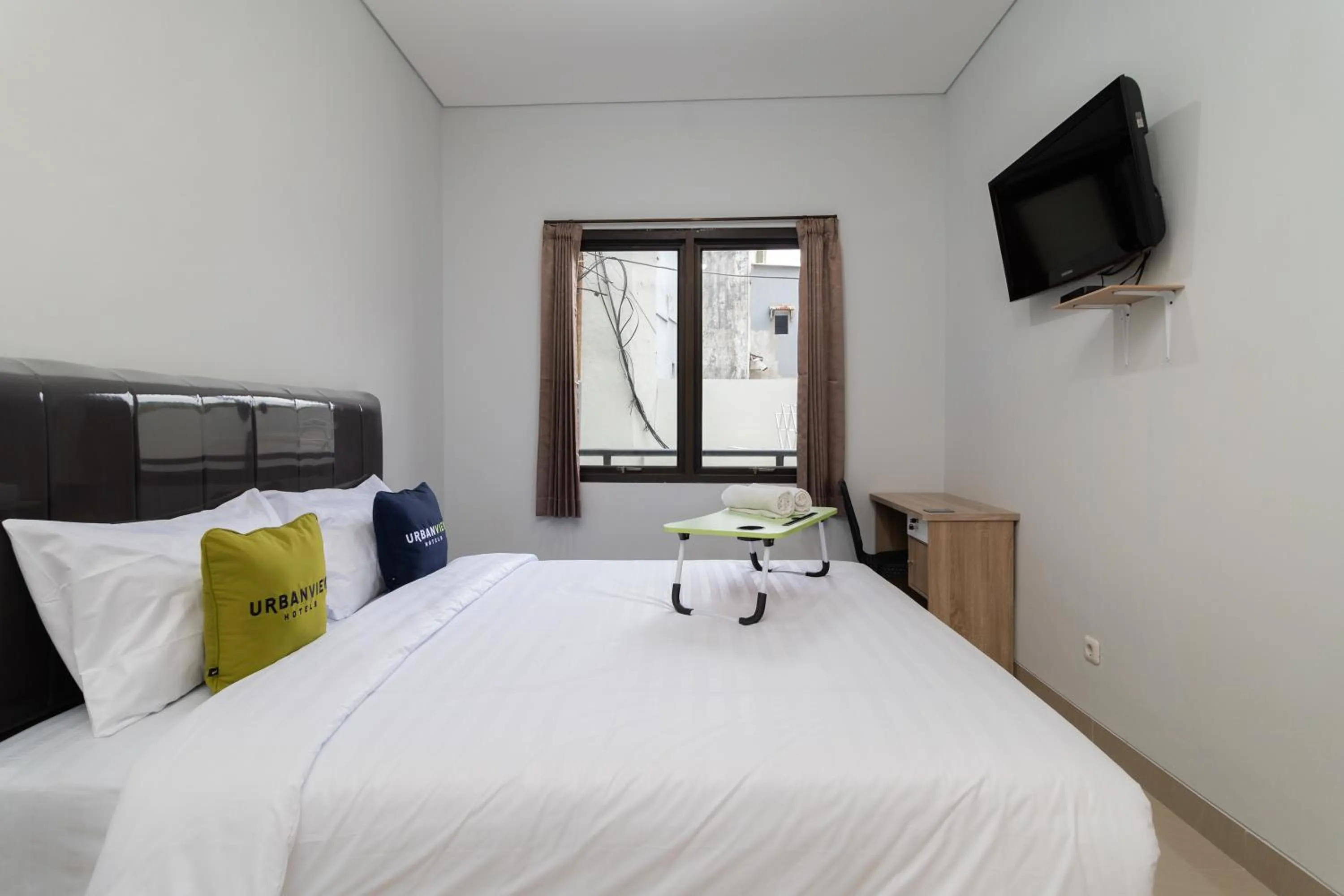 Bedroom, Bed in Urbanview Hotel Pasar Baru Jakarta by RedDoorz