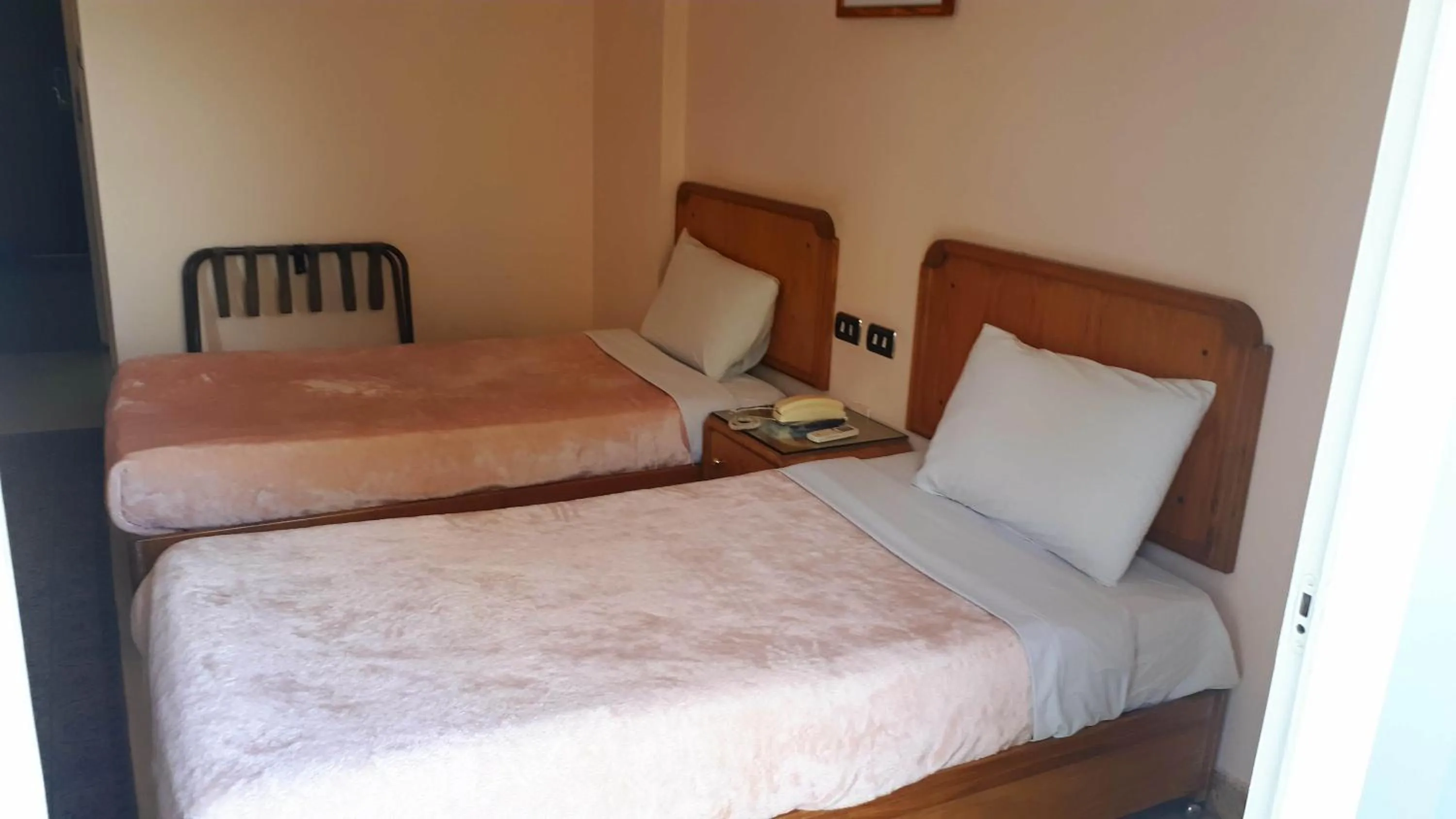 Bed in New Pola Hotel