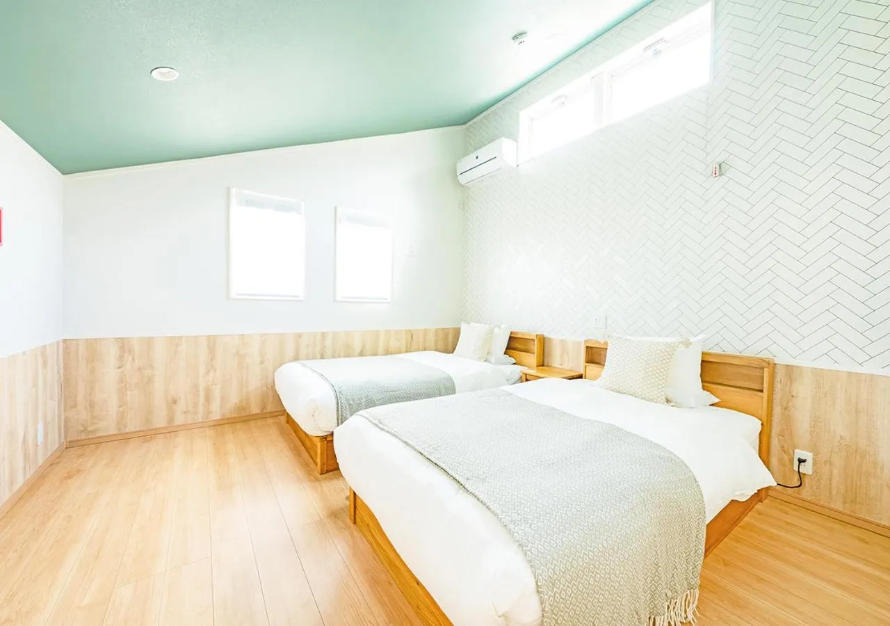 Bed in Villa Malibu Palm Springs Miyakojima Resort