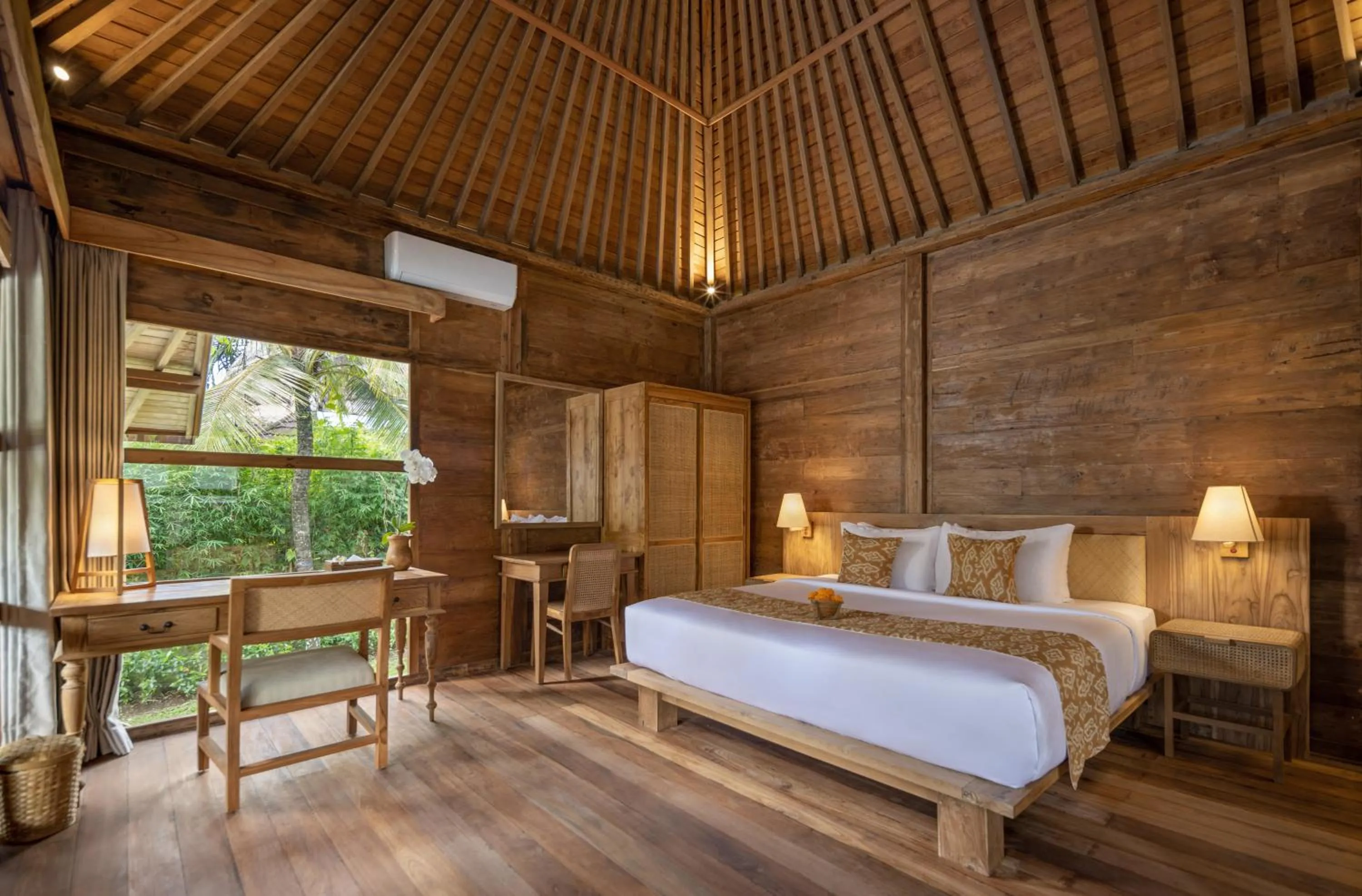 Bed in RUMAH KAYU RESORT