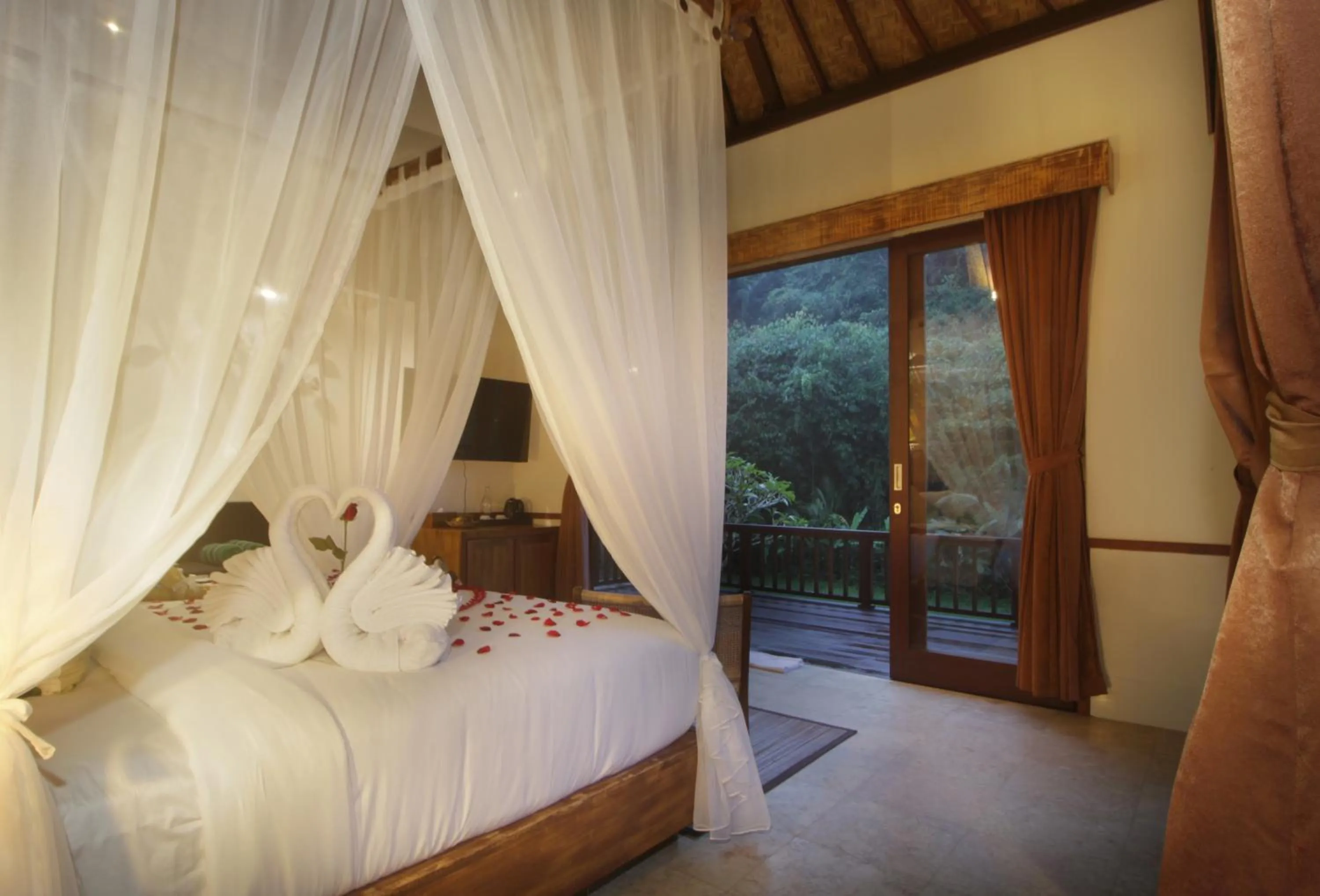 Bed in The Tirta Sari Villas