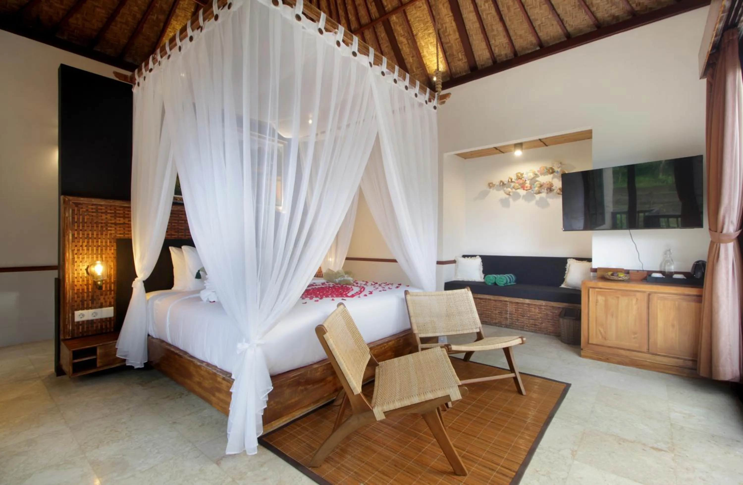 Bed in The Tirta Sari Villas