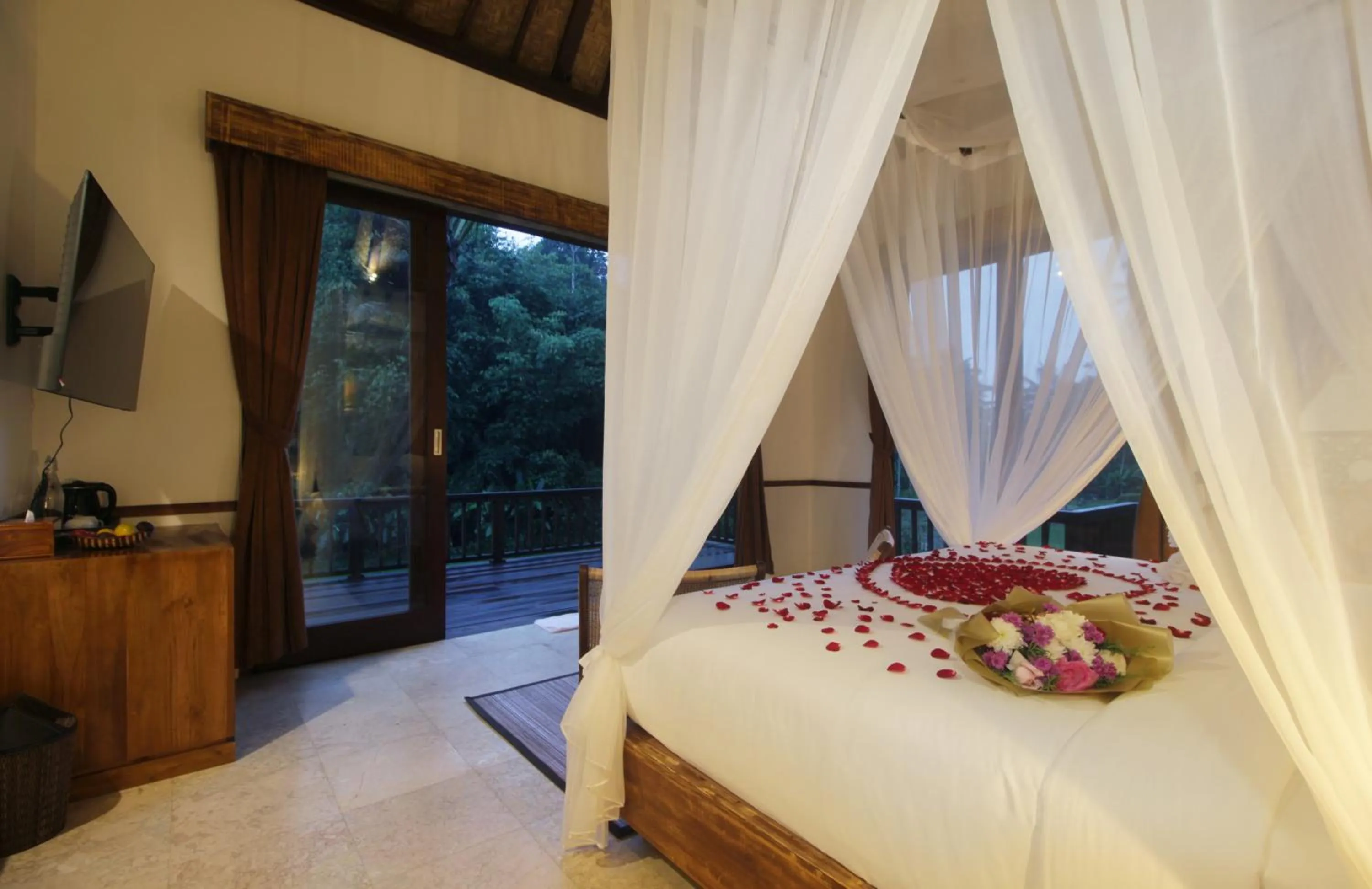 Bed in The Tirta Sari Villas