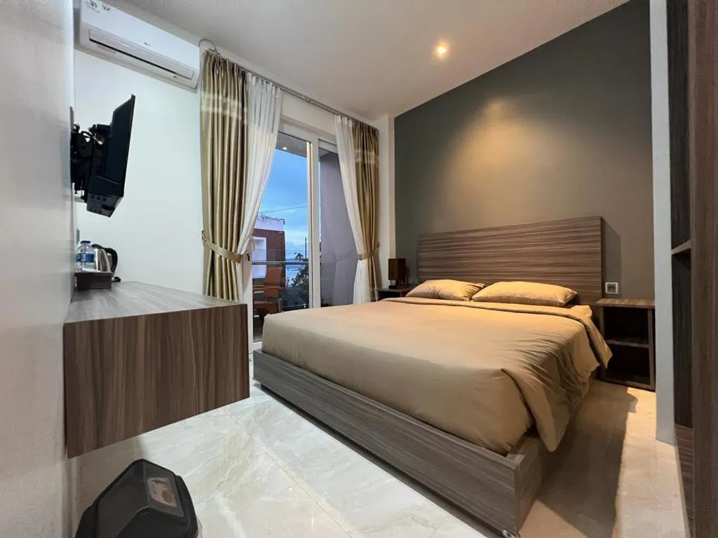 Bed in PURNAMA BALIGE HOTEL