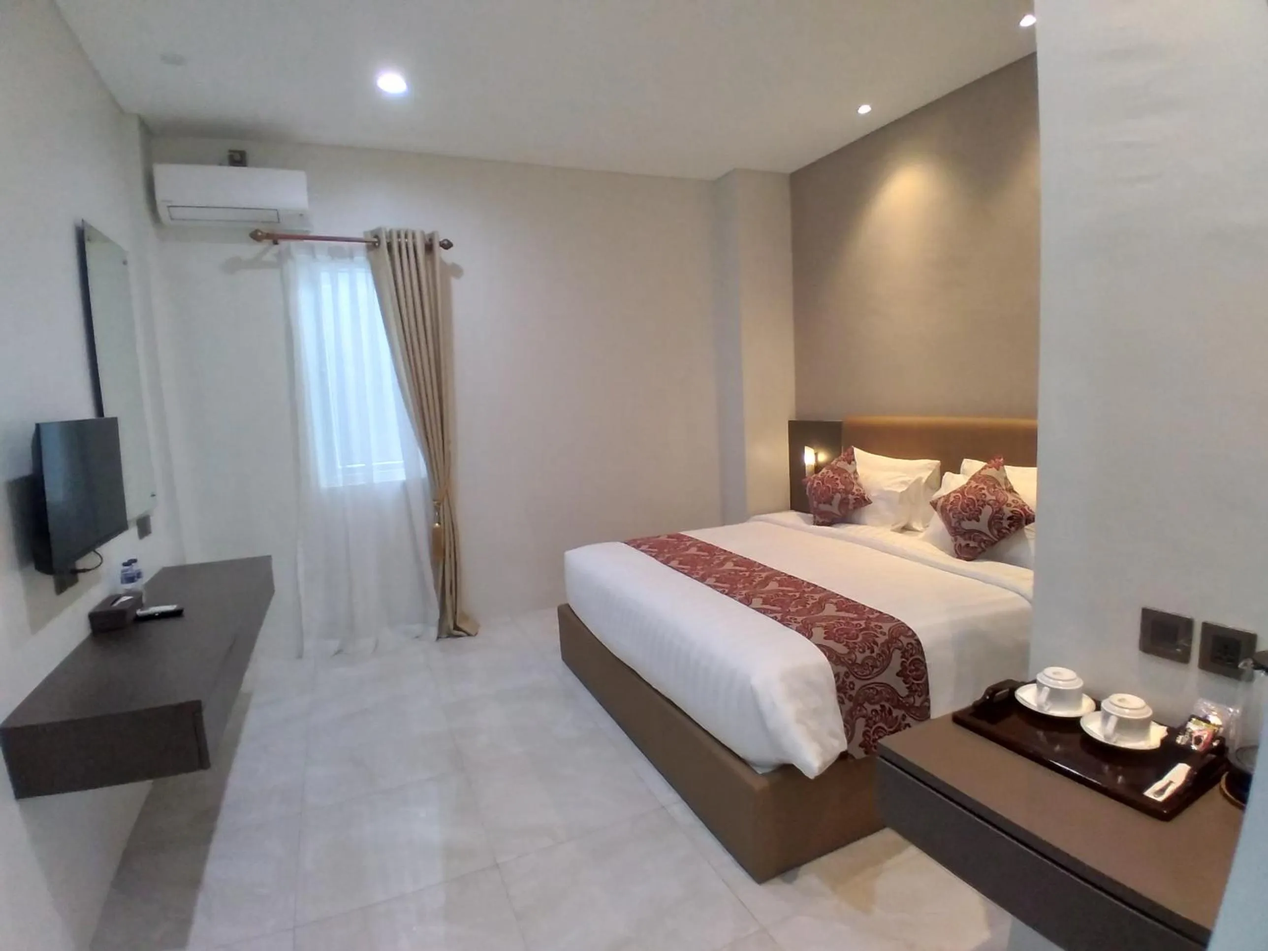 Bed in PURNAMA BALIGE HOTEL
