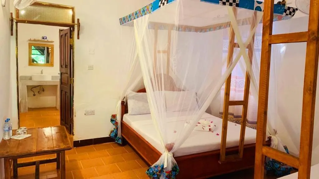 Bed in Sipano Beach Lodge Kiwengwa