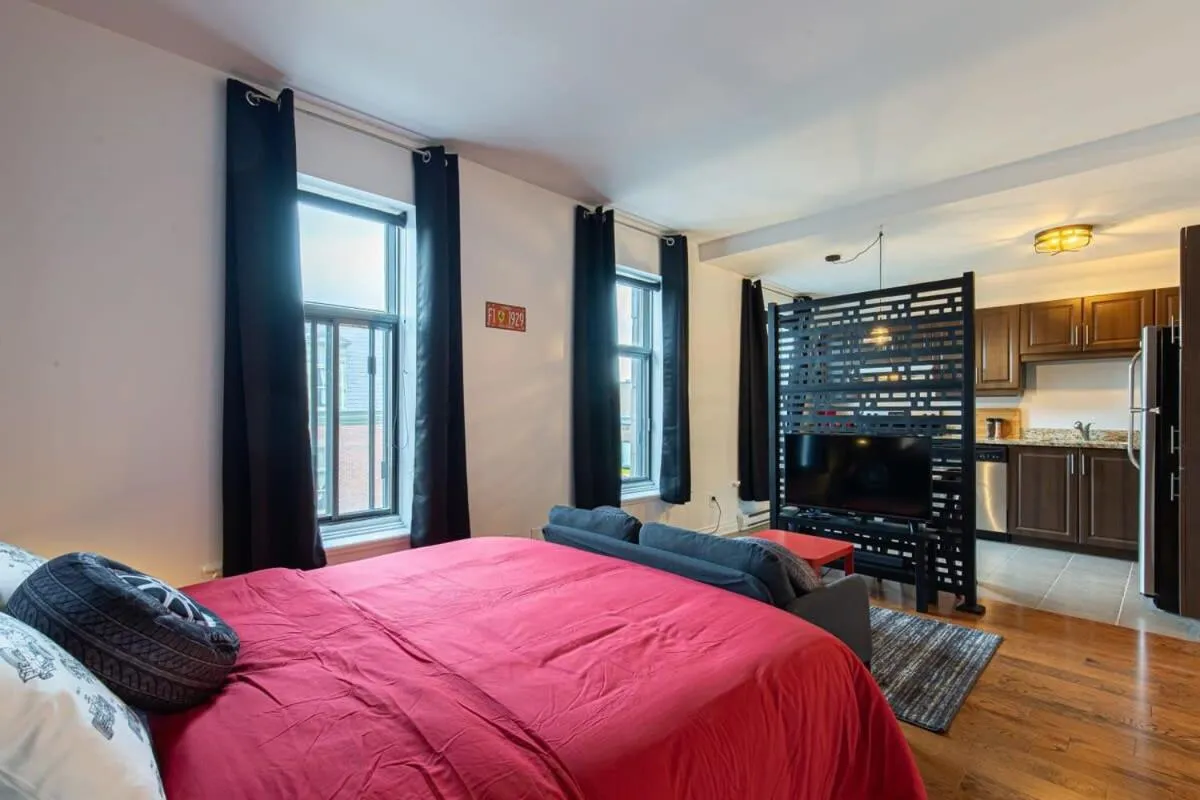 Bed in The Grand Prix Suite In the heart of MTL - M11 Rentals