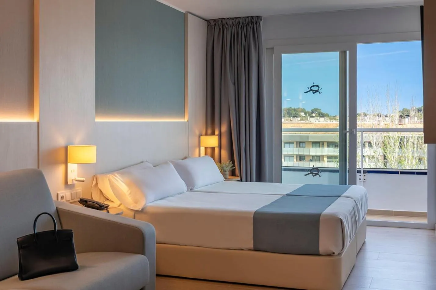 Bed in Costa Encantada Resort & Suites