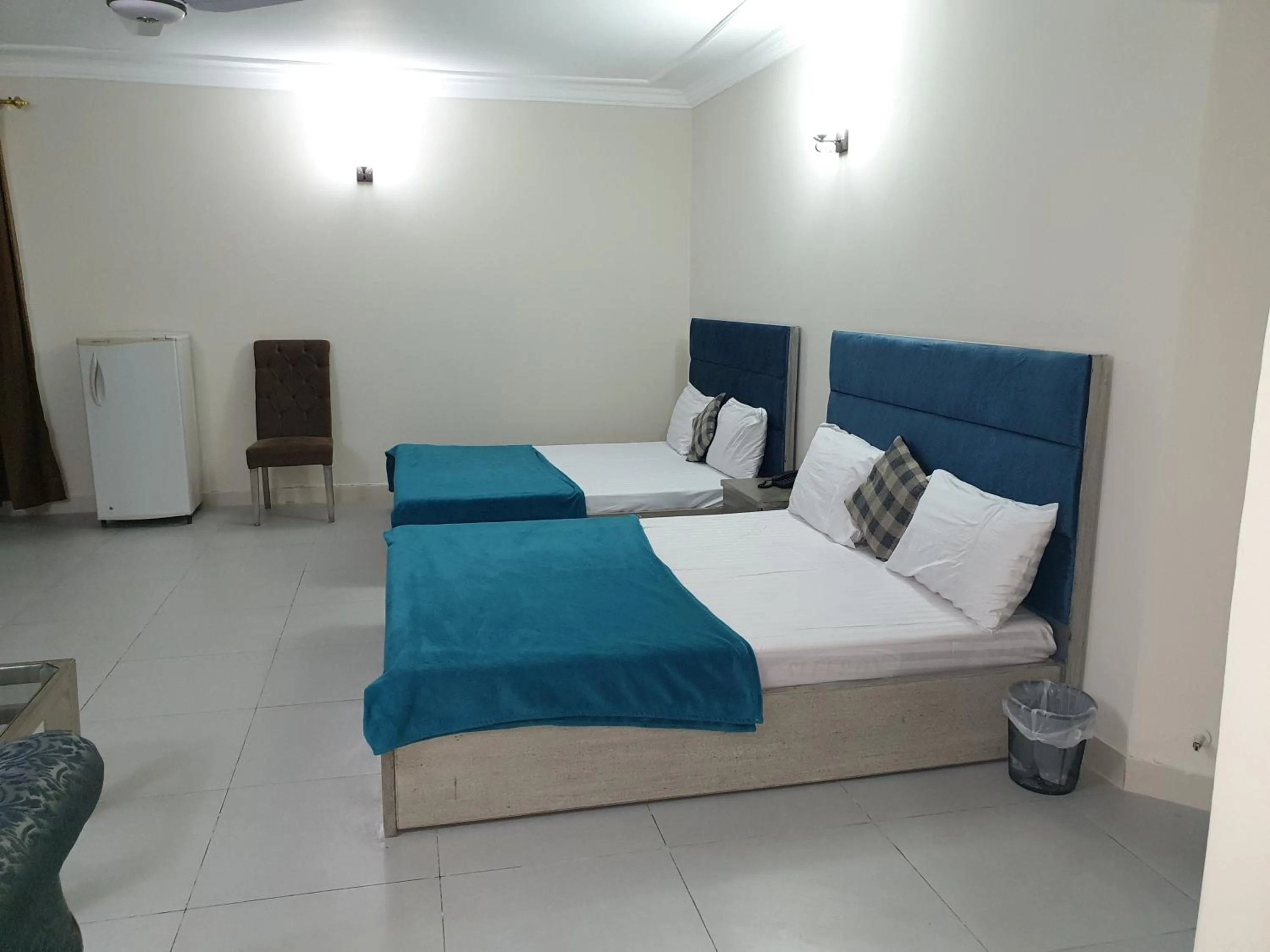 Bed in MUDAN Residency