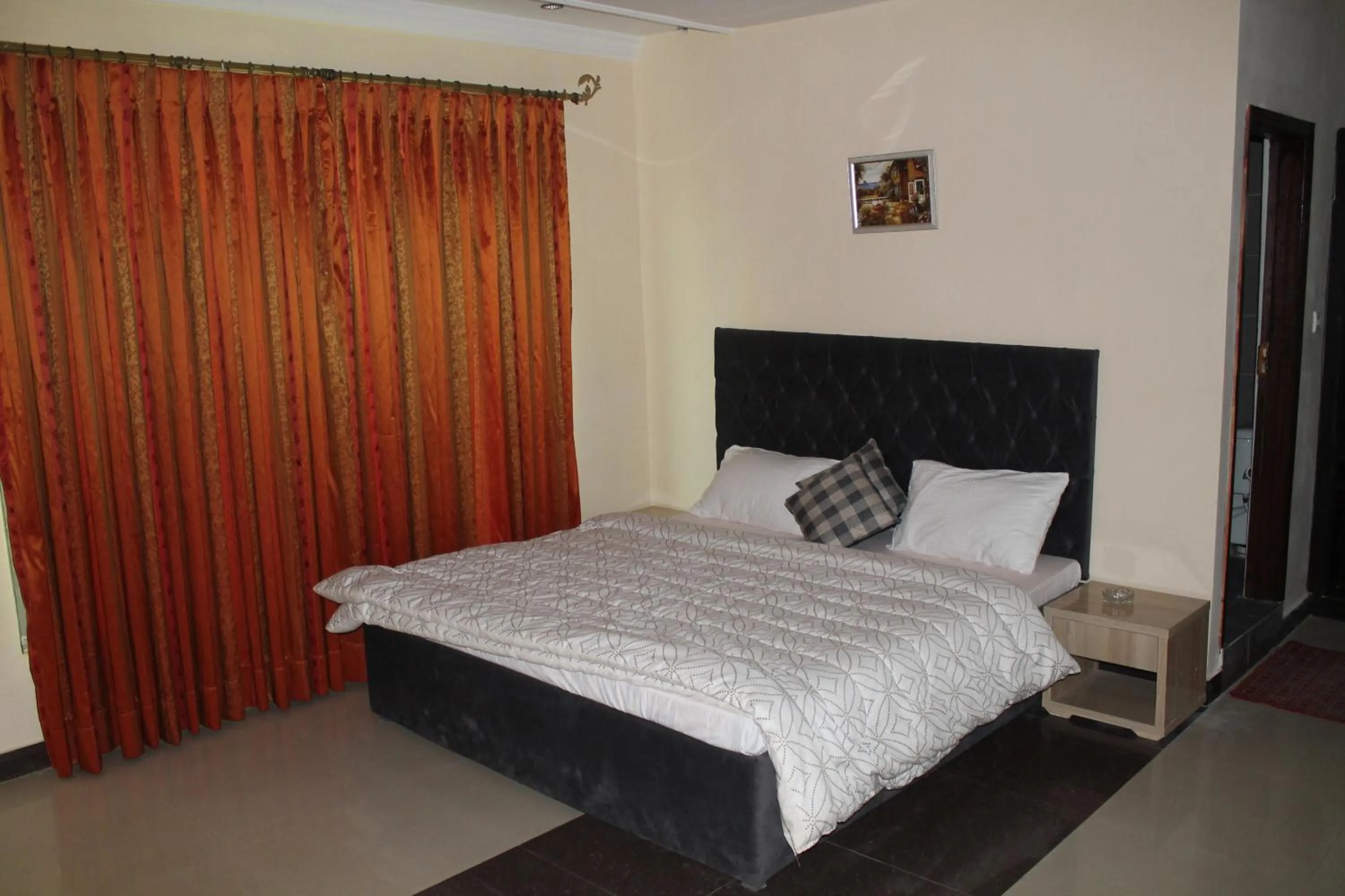 Bed in MUDAN Residency