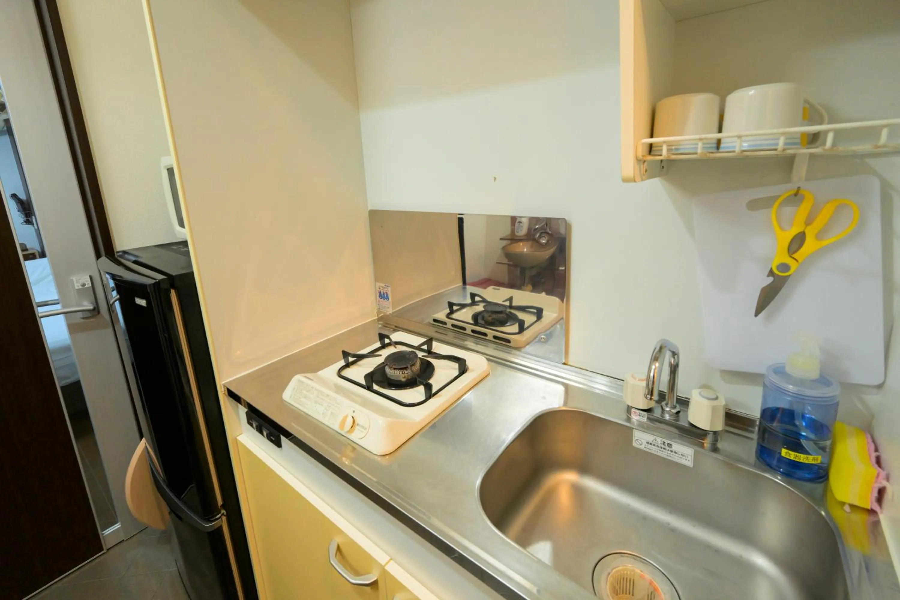 Kitchen or kitchenette in HOTEL AARON通天東