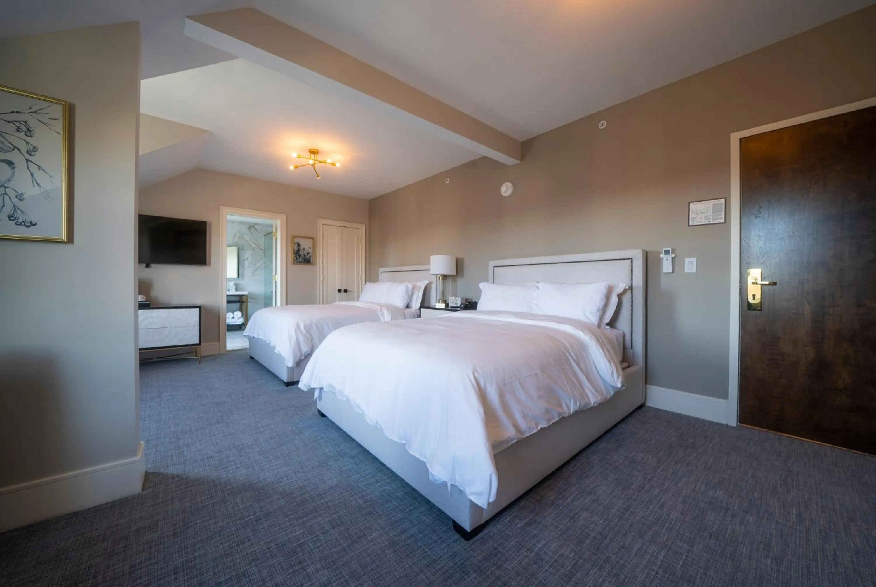 Bed in Orange Inn Boutique Hotel