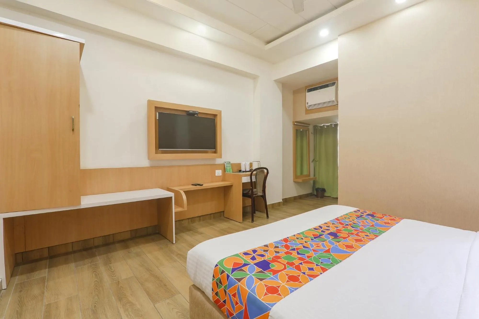 Bed in FabHotel Raghubar Kripa