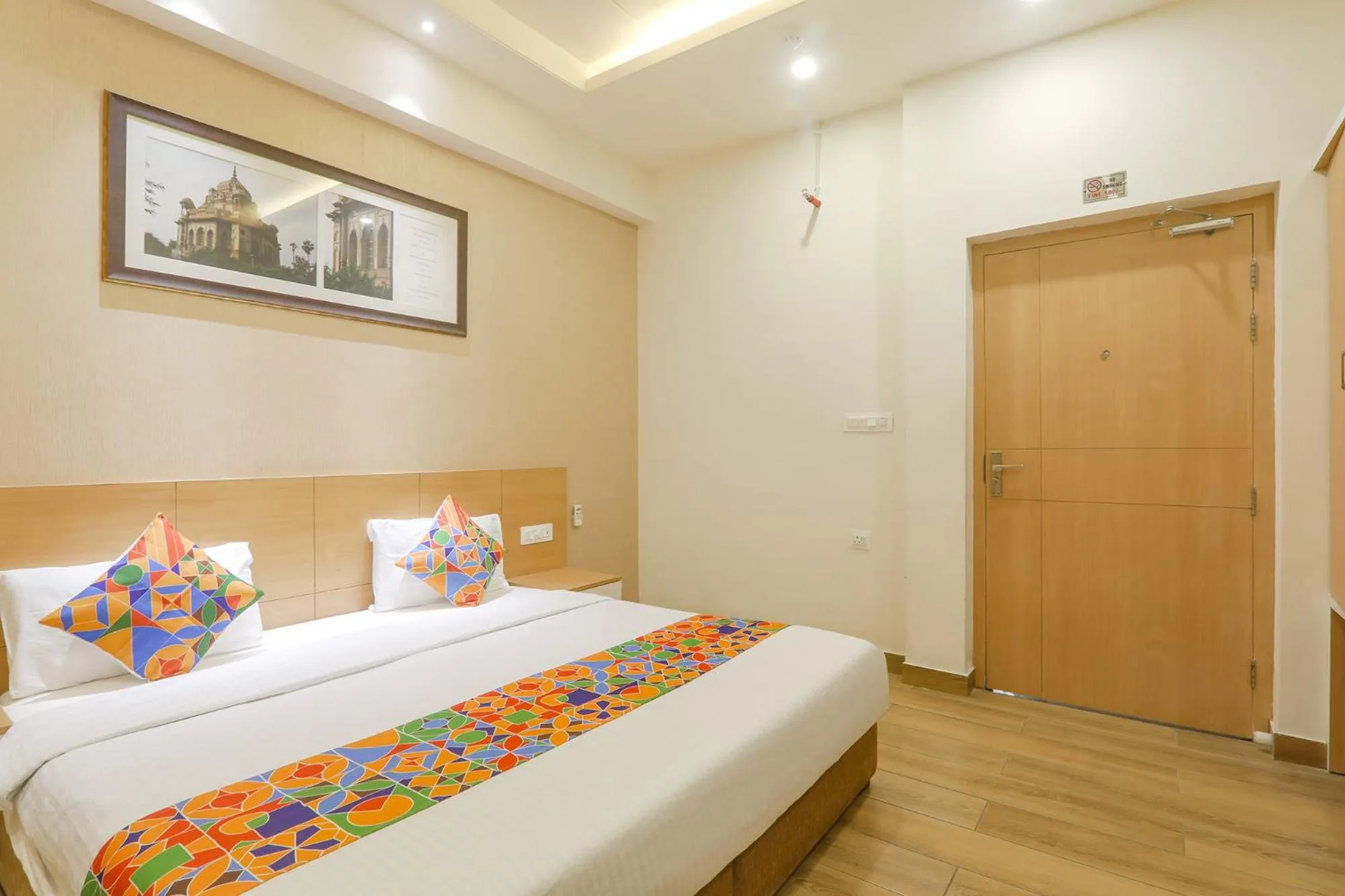 Bed in FabHotel Raghubar Kripa