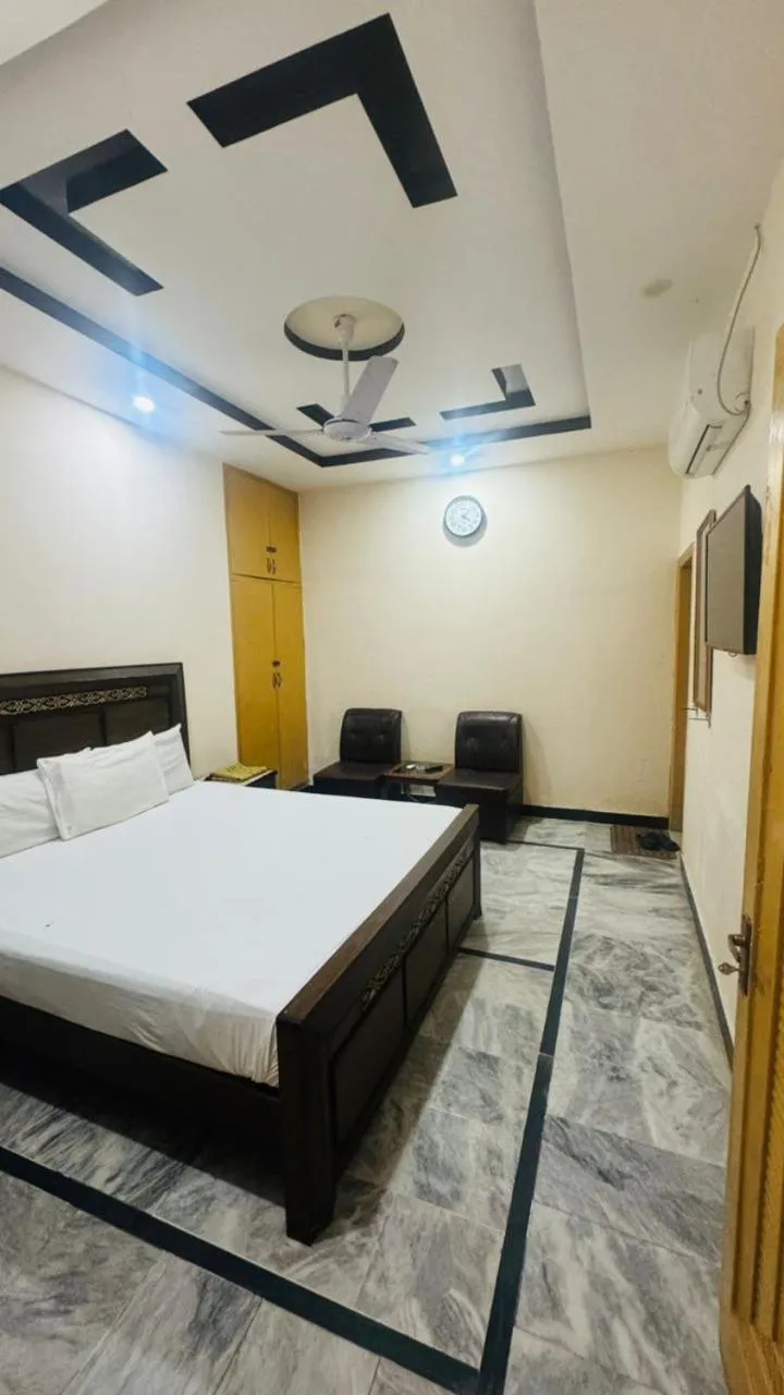 Bed in New Palace Guest House